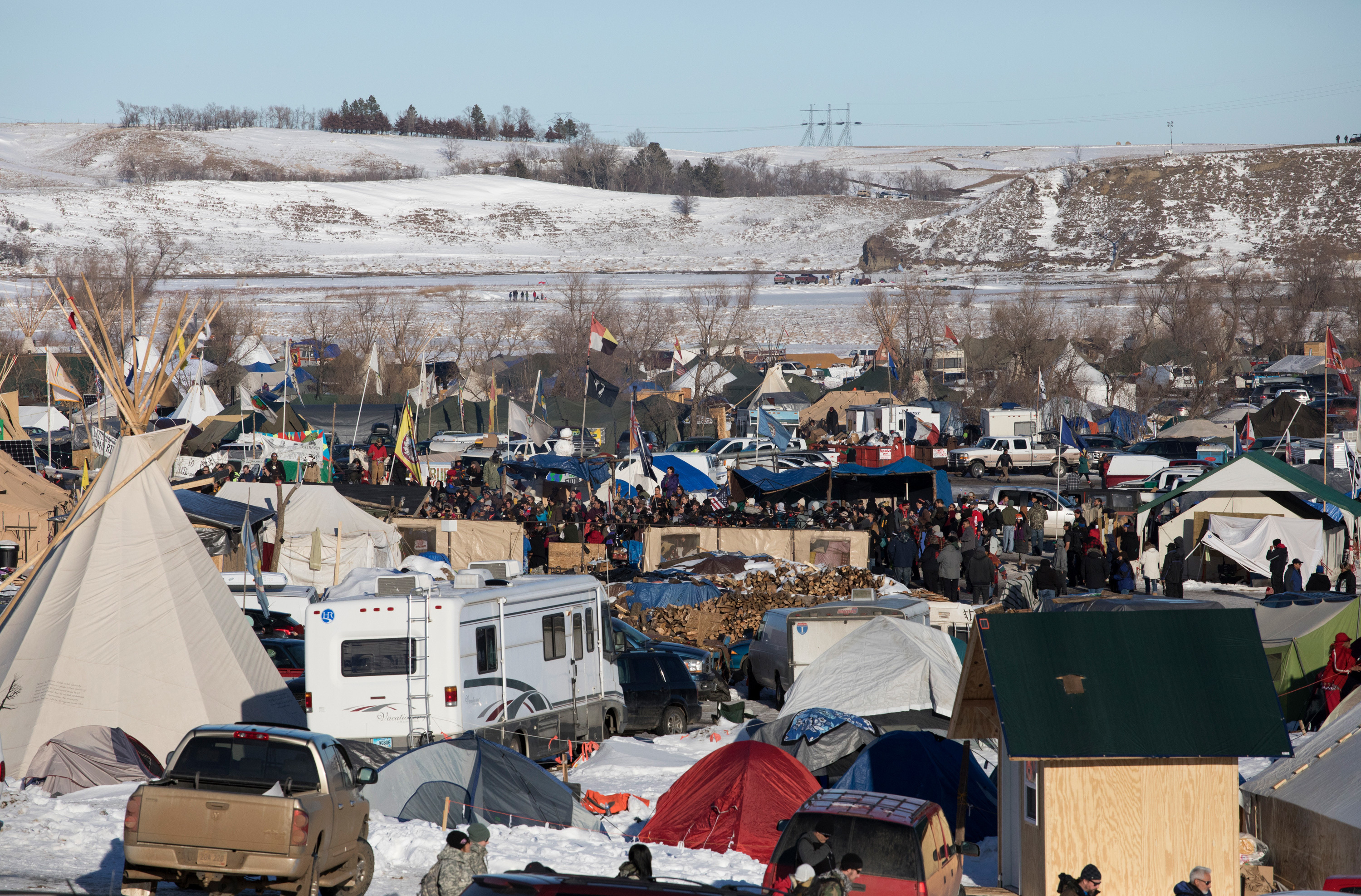 On Sunday, protesters gather at their camp as news breaks that the Army Corps of Engineers will not approve an easement for the Dakota Access Pipeline. (Cassi Alexandra for NPR)
