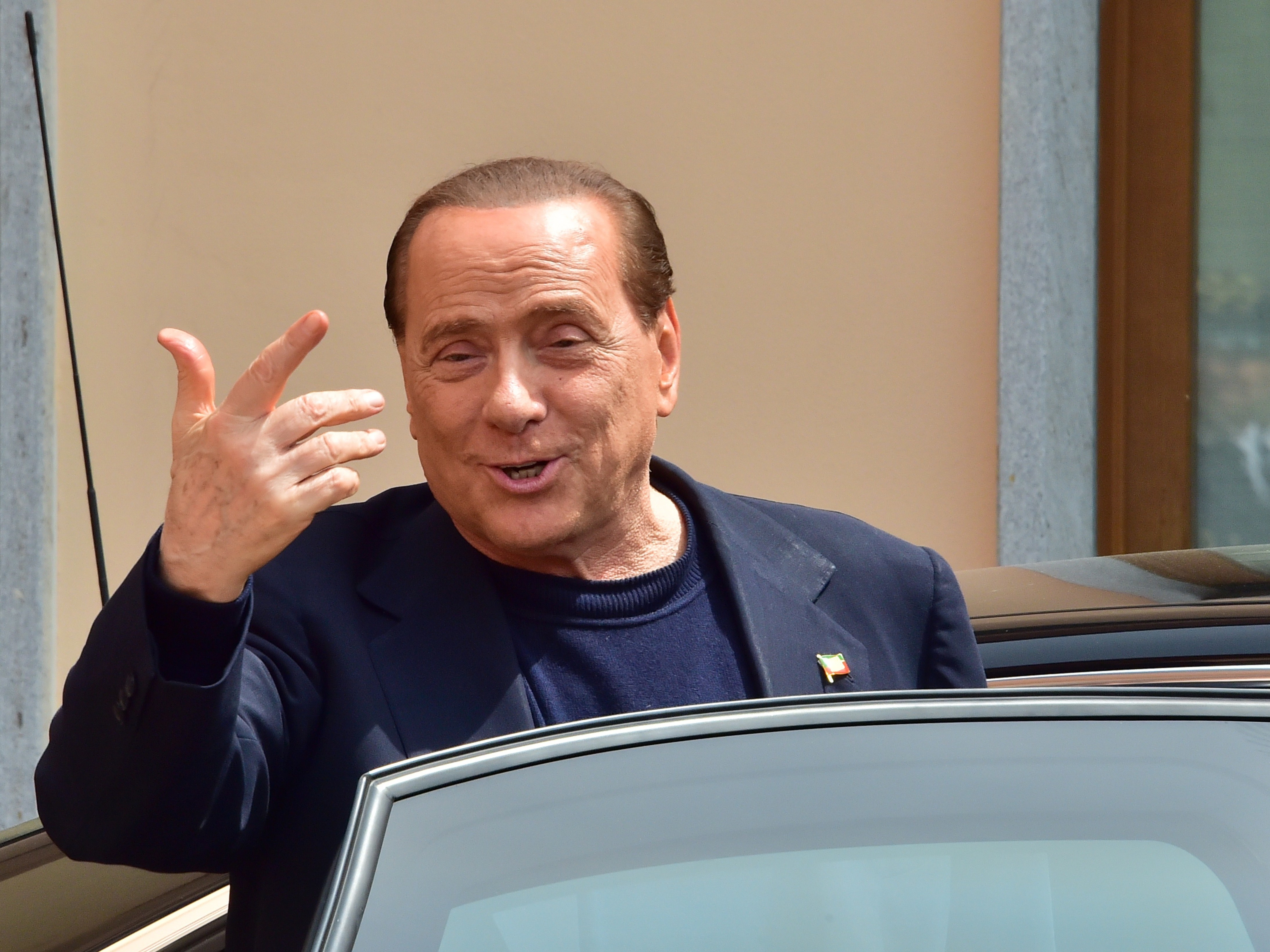 Former Italian Prime Minister Silvio Berlusconi leaves a Catholic hospice in Cesano Boscone on May 9, 2014, after serving his first day of community service for tax fraud. (AFP/Getty Images)