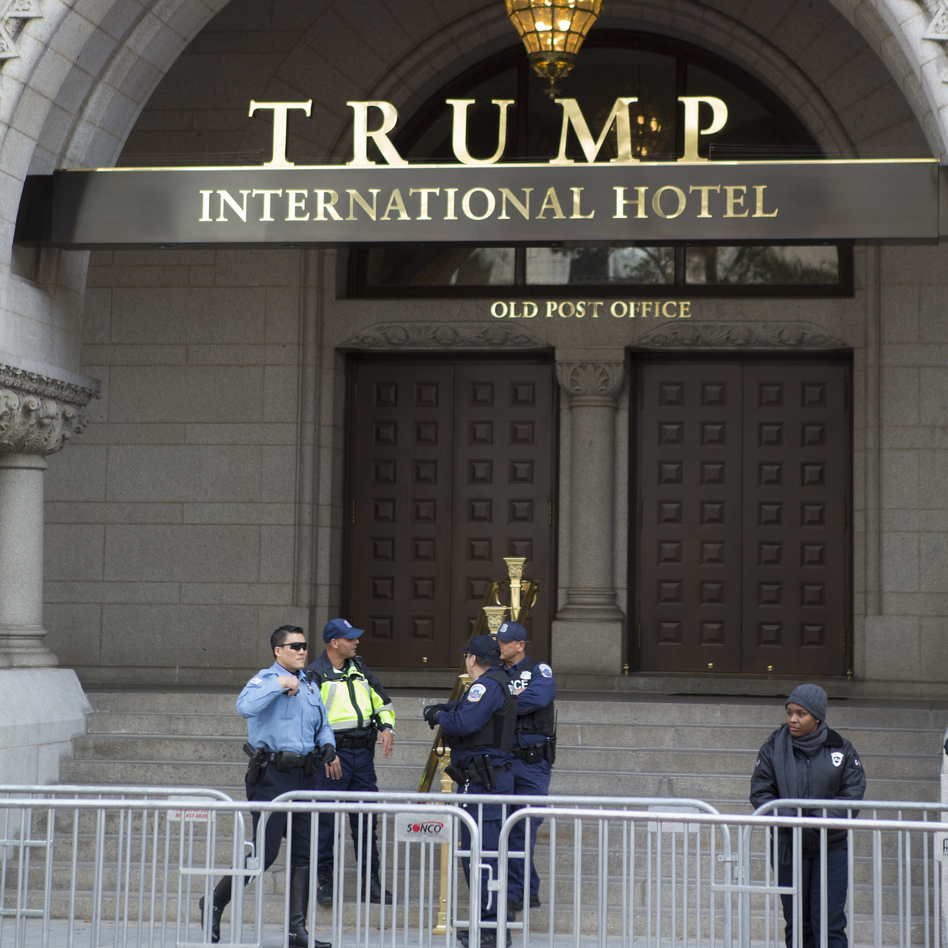 President-elect Donald Trump's organization holds the lease on, and has opened a hotel in, a prominent building in Washington, D.C., one of many business interests that could lead to conflicts with his role as president. (Jon Elswick/AP)
