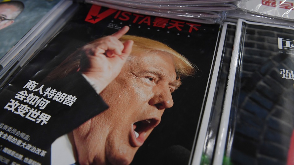 A magazine featuring U.S. President-elect Donald Trump is seen at a bookstore in Beijing on Monday. The headline reads, "How will businessman Trump change the world?" Beijing is "seriously concerned" by Trump's suggestion that he could drop Washington's "One China" policy, officials said Monday. (Greg Baker/AFP/Getty Images)