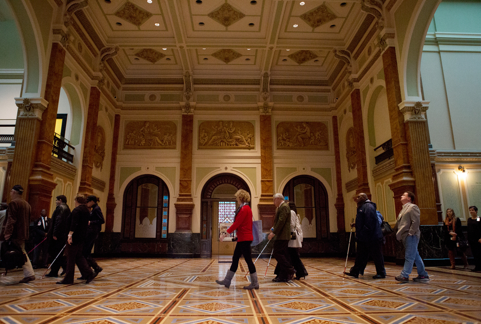 Docents on the America InSight tours guide visitors through the Smithsonian American Art Museum. (Raquel Zaldivar/NPR)