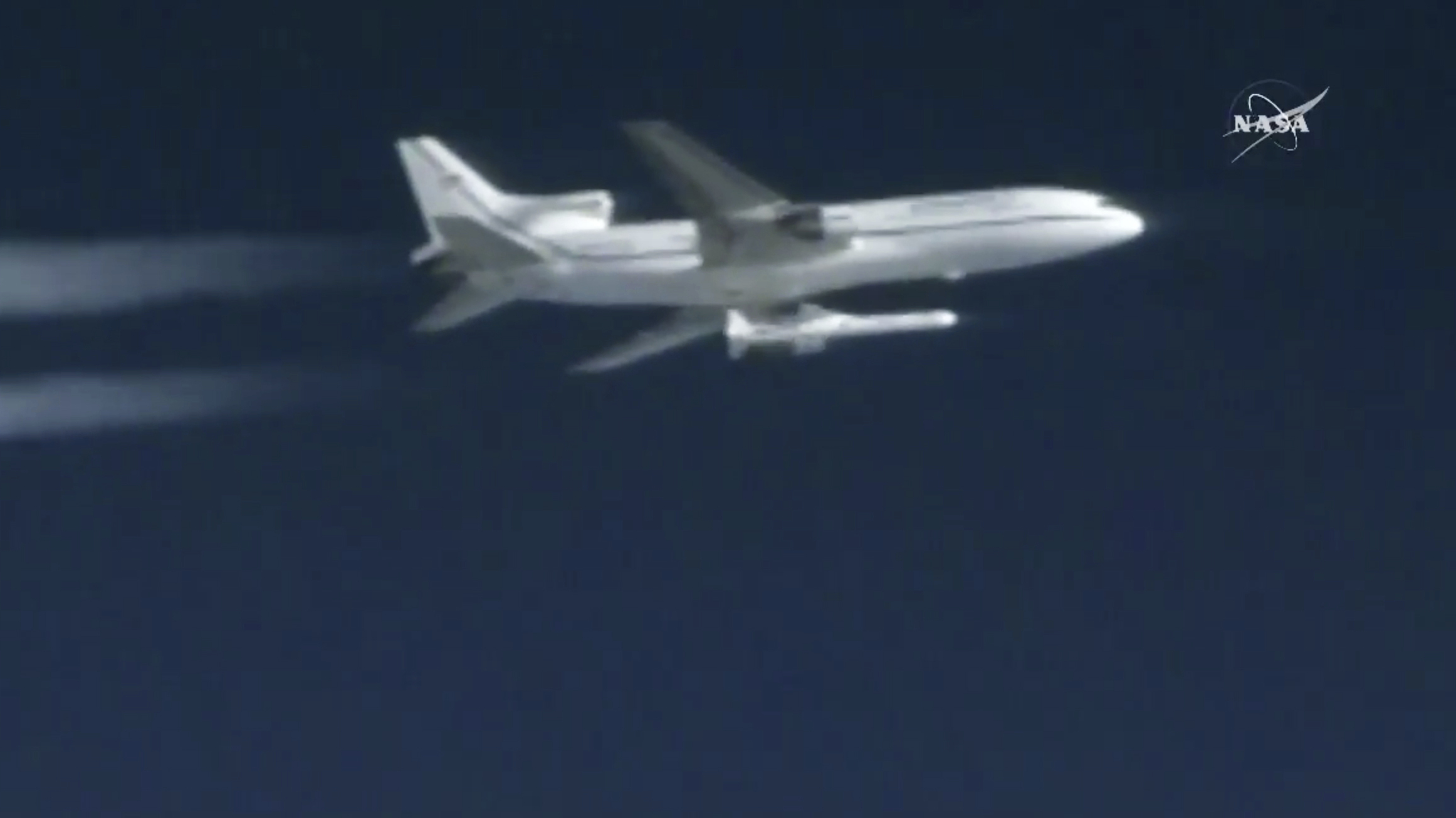 A Pegasus rocket containing eight mini-satellites is air-launched on Thursday.