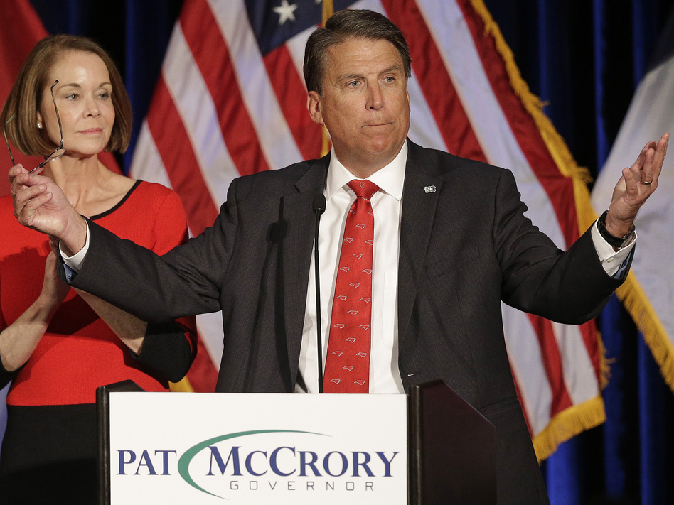 North Carolina Gov. Pat McCrory, accompanied by his wife, Ann McCrory, speaks to supporters at a postelection rally in Raleigh, N.C., on Nov. 9. McCrory was not re-elected. (Chuck Burton/AP)