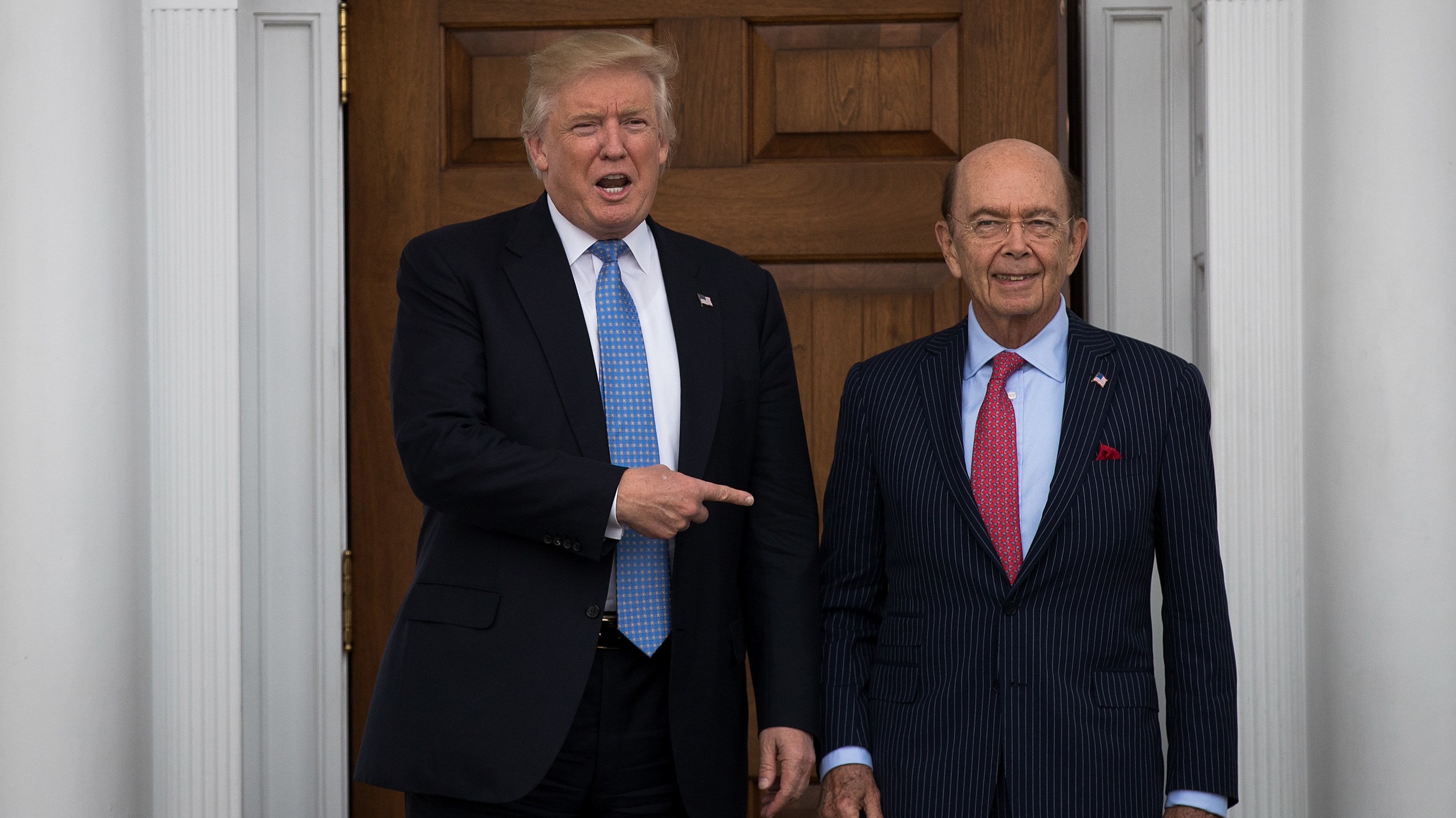 President-elect Donald Trump and investor Wilbur Ross, his nominee for commerce secretary, pose for a photo following their meeting at Trump International Golf Club in Bedminster, N.J., on Nov. 20. (Getty Images)