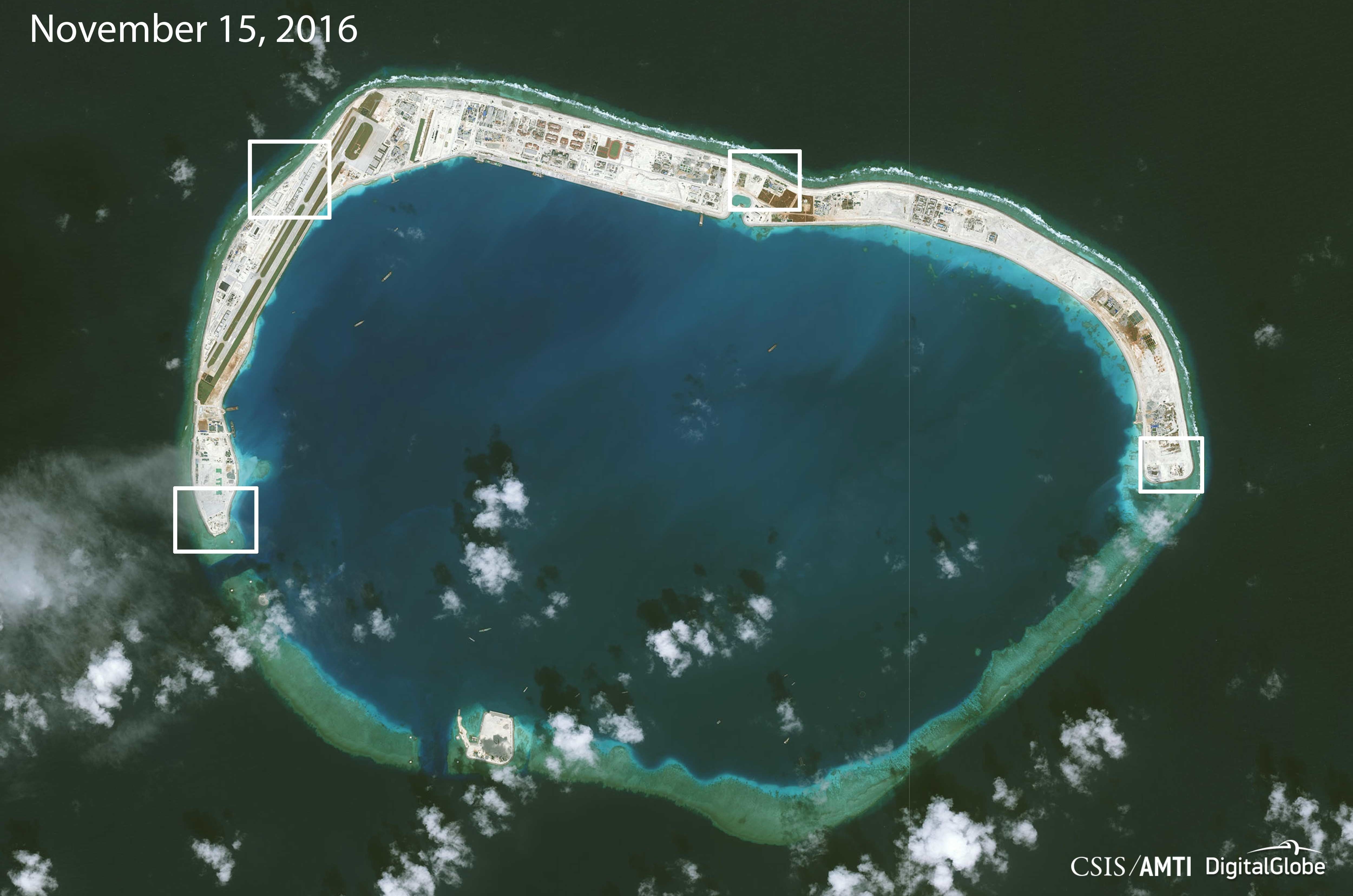 Highlighting new areas of Chinese construction on Mischief Reef, a monitoring group says that in addition to an airstrip, the artificial island will likely be outfitted with large anti-aircraft guns and a cruise missile defense system. (CSIS/AMTI/DigitalGlobe)