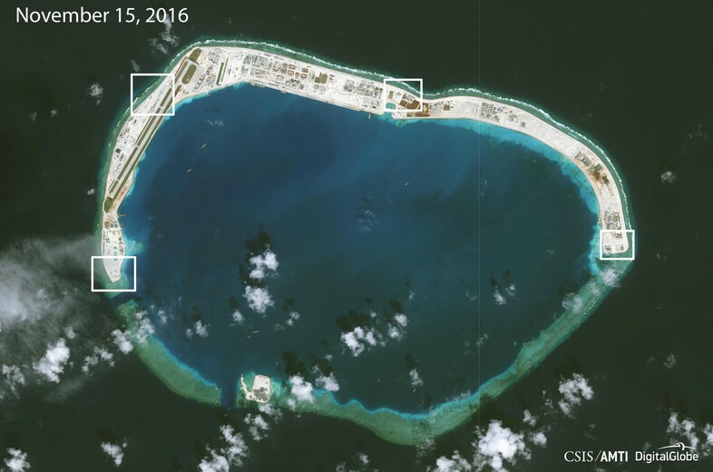 Highlighting new areas of Chinese construction on Mischief Reef, a monitoring group says that in addition to an airstrip, the artificial island will likely be outfitted with large anti-aircraft guns and a cruise missile defense system. (CSIS/AMTI/DigitalGlobe)