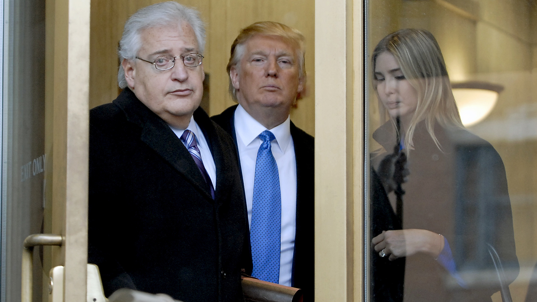 Attorney David Friedman (left) exits U.S. Bankruptcy Court in Camden, N.J., with Donald Trump and Trump's daughter Ivanka in a 2010 case involving Atlantic City casinos. The president-elect plans to nominate Friedman as U.S. ambassador to Israel. (Bloomberg via Getty Images)