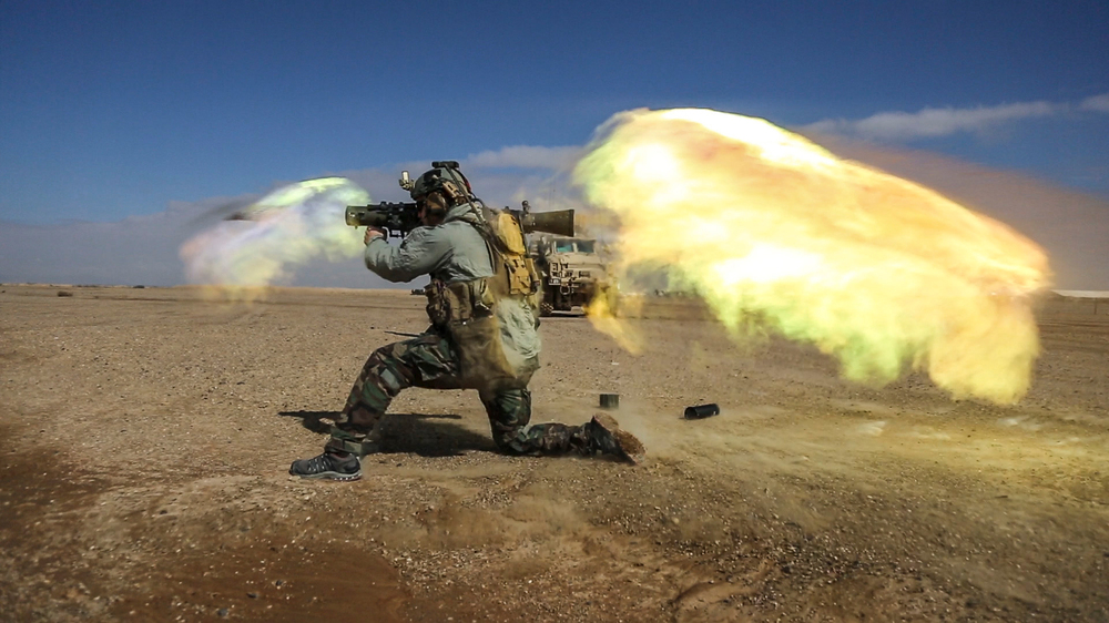 A soldier fires a Carl Gustav recoilless rifle system during weapons practice in Helmand province, Afghanistan. Heavy weapons like these generate a shock wave that may cause brain injuries. (CJSOTF-A/DVIDS)