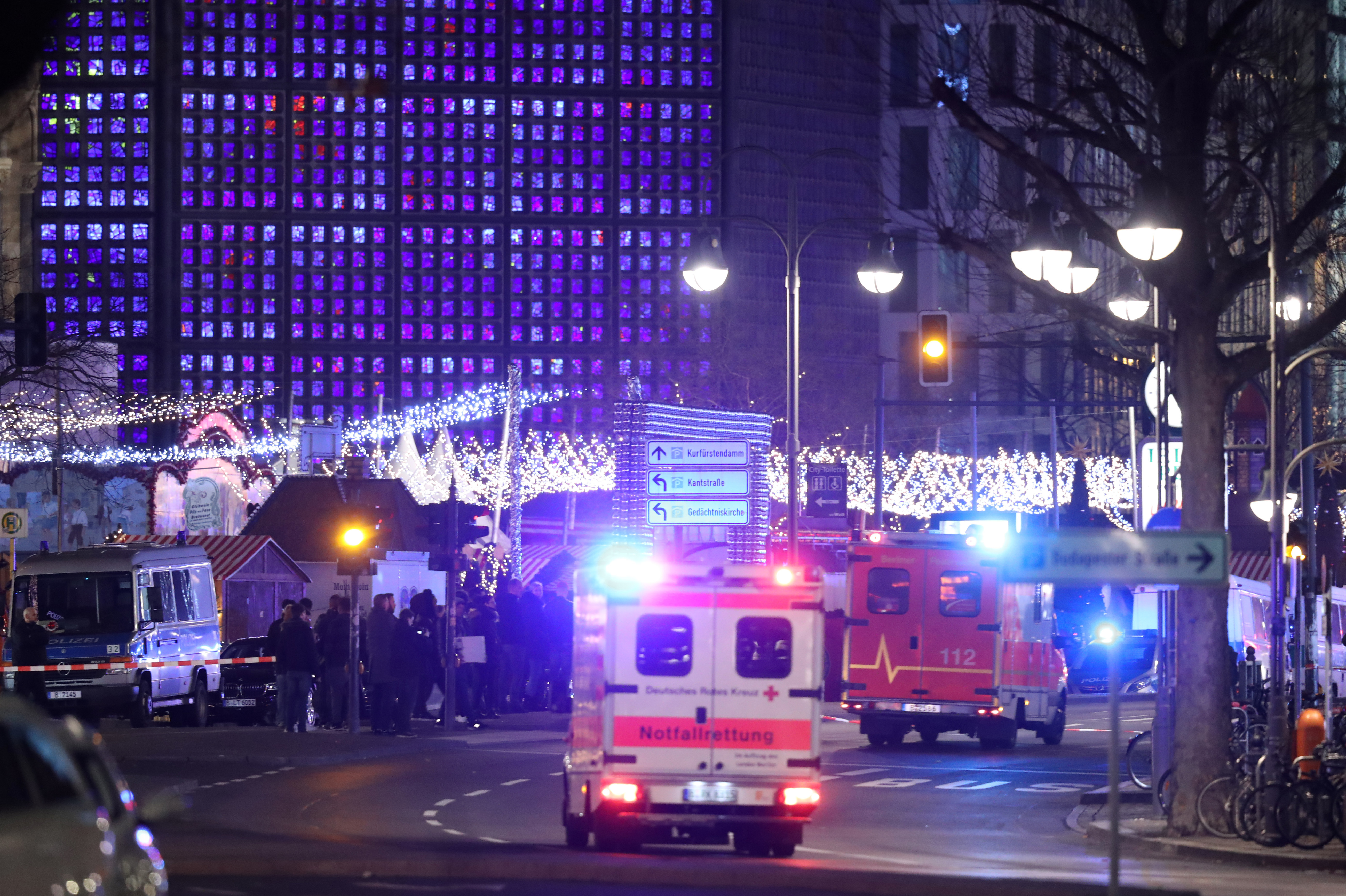 An ambulance and rescue workers arrive on the scene after someone drove a truck through a Christmas market in Berlin on Monday. (Getty Images)