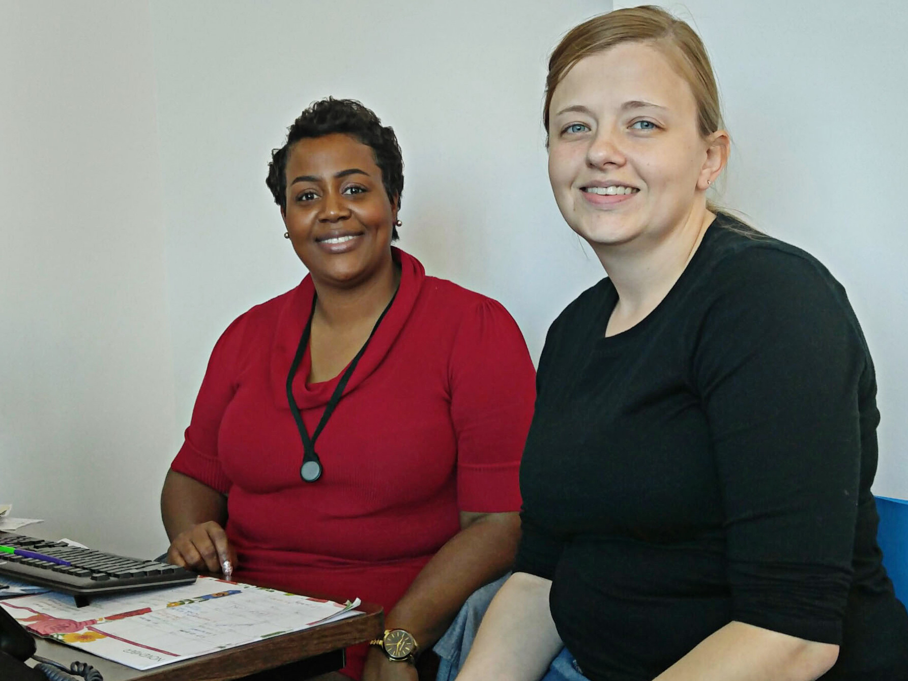 Sharita Moultrie, left, a navigator with the Palmetto Project, helps Stephanie Hickman enroll in an Obamacare plan in Columbia, S.C.