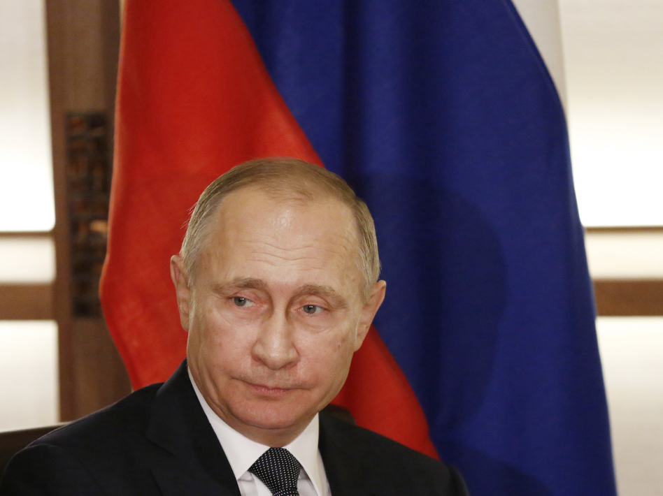 U.S. intelligence agencies maintain that Russian President Vladimir Putin personally authorized the hacking of Democratic officials' email accounts during the runup to the presidential election. (Toru Hanai/AP)