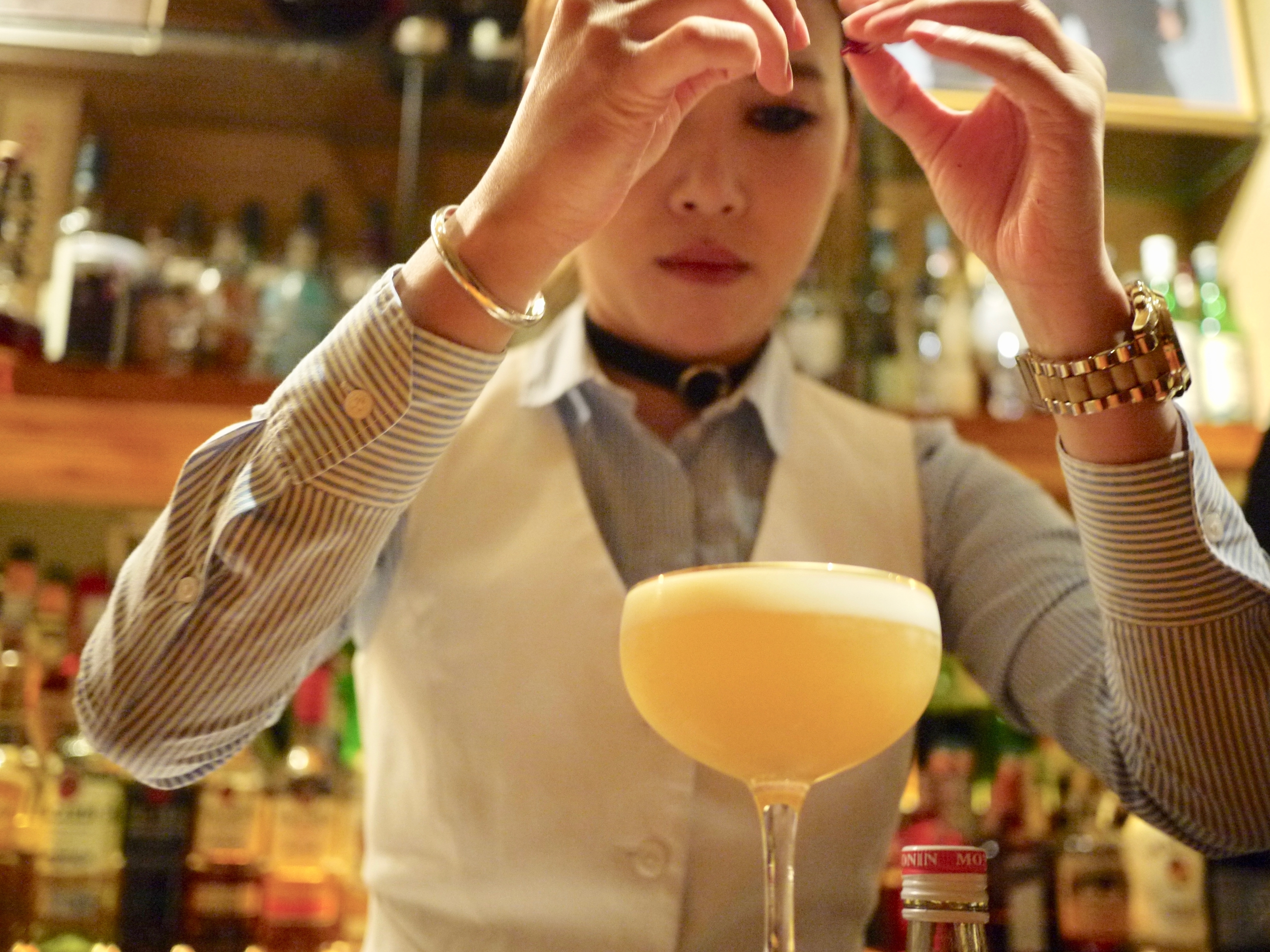 Moe mixes a Korean sour at her bar, Moju, in Shanghai. In October, she won an international cocktail competition for her signature drink, the sakura.