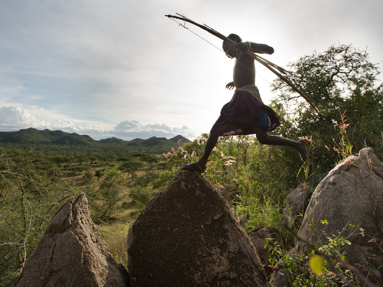 A Hadza man on a hunt, with his bow and arrow. (Matthieu Paley/National Geographic)