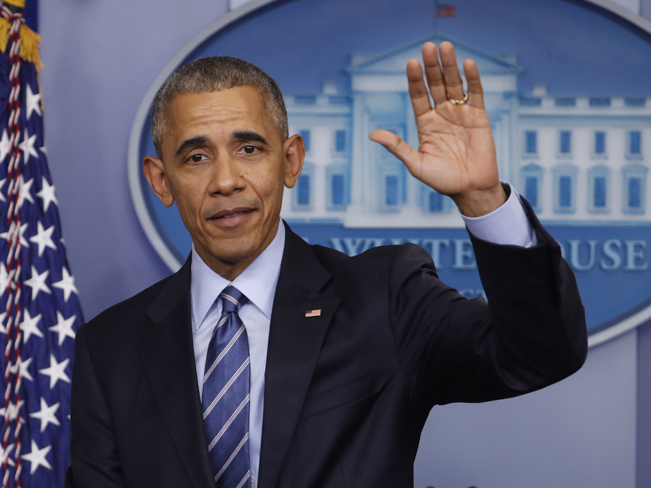 President Obama waves at the conclusion of his news conference in the briefing room of the White House on Dec. 16. (Pablo Martinez Monsivais/AP)