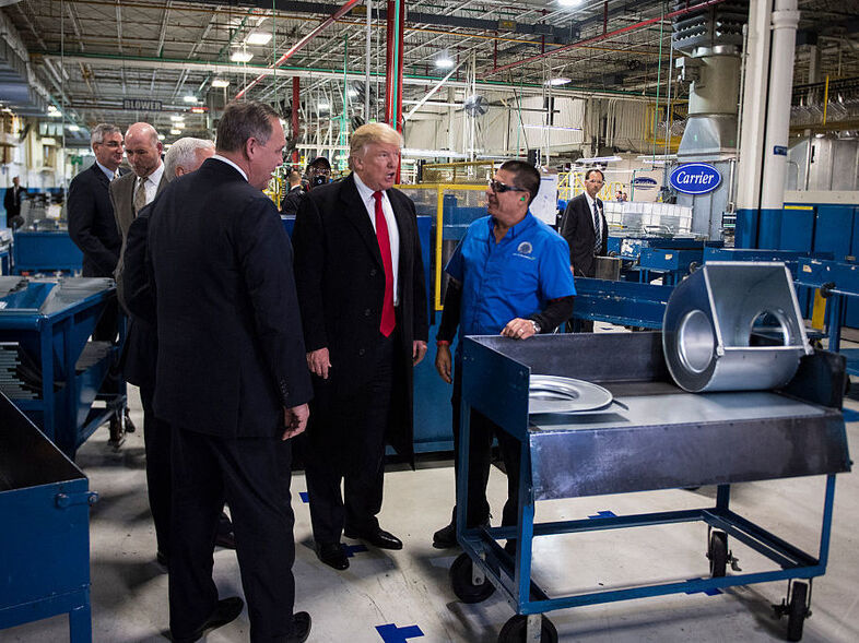 President-elect Donald Trump tours the Carrier Corp. in Indianapolis following the company's announcement it would keep hundreds of manufacturing jobs in the United States rather than move them to Mexico. (Jabin Botsford/The Washington Post/Getty Images)