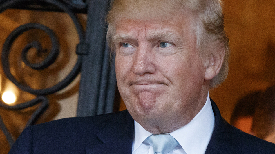 President-elect Donald Trump talks to reporters at Mar-a-Lago in Palm Beach, Fla., last month. He met Friday with top U.S. intelligence officials about Russian interference in the election. (Evan Vucci/AP)