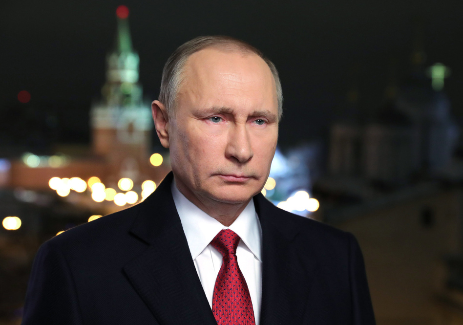 Russian President Vladimir Putin speaks during his annual televised New Year's message in the Kremlin in Moscow. (Mikhail Klimentyev/AP)