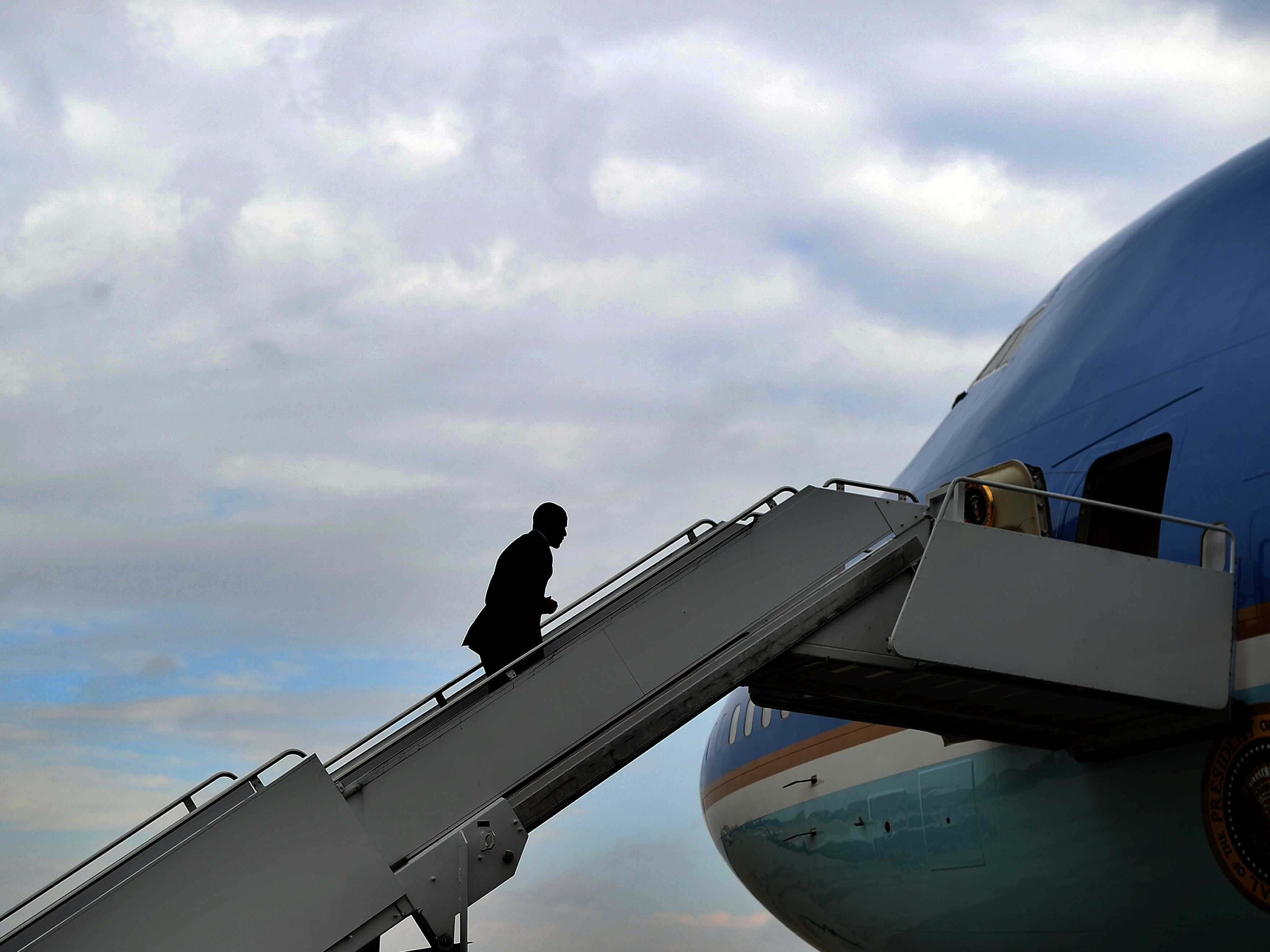 President Barack Obama boards Air Force One at Andrews Air Force Base in Maryland on October 30, 2013. President Obama will complete two terms as president next week. (JEWEL SAMAD/AFP/Getty Images)