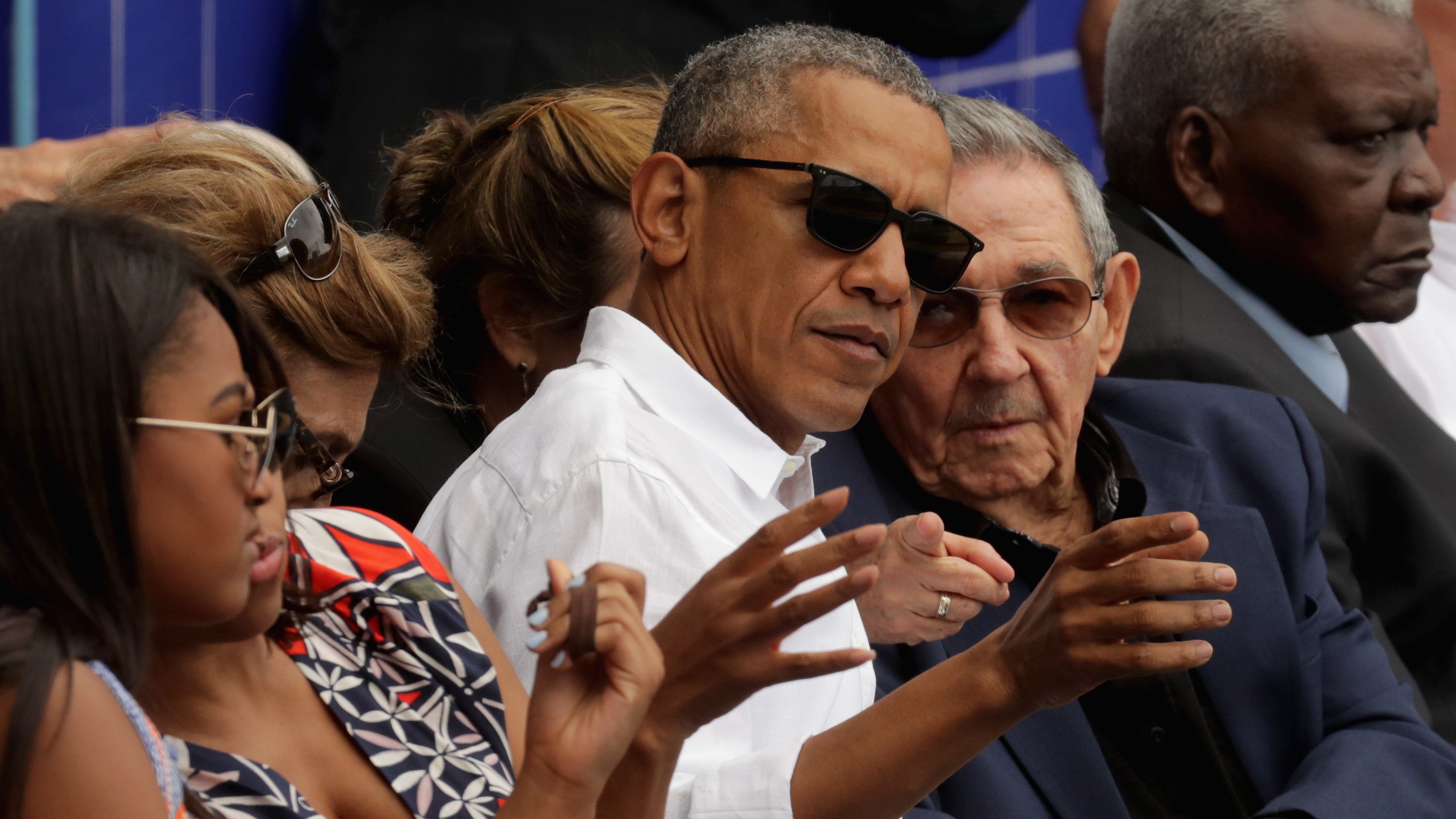 President Barack Obama and Cuban President Raul Castro visit during an exhibition game between the Cuban national team and the Major League Baseball team Tampa Bay Devil Rays at the Estado Latinoamericano March 22, 2016 in Havana, Cuba. (Chip Somodevilla/Getty Images)