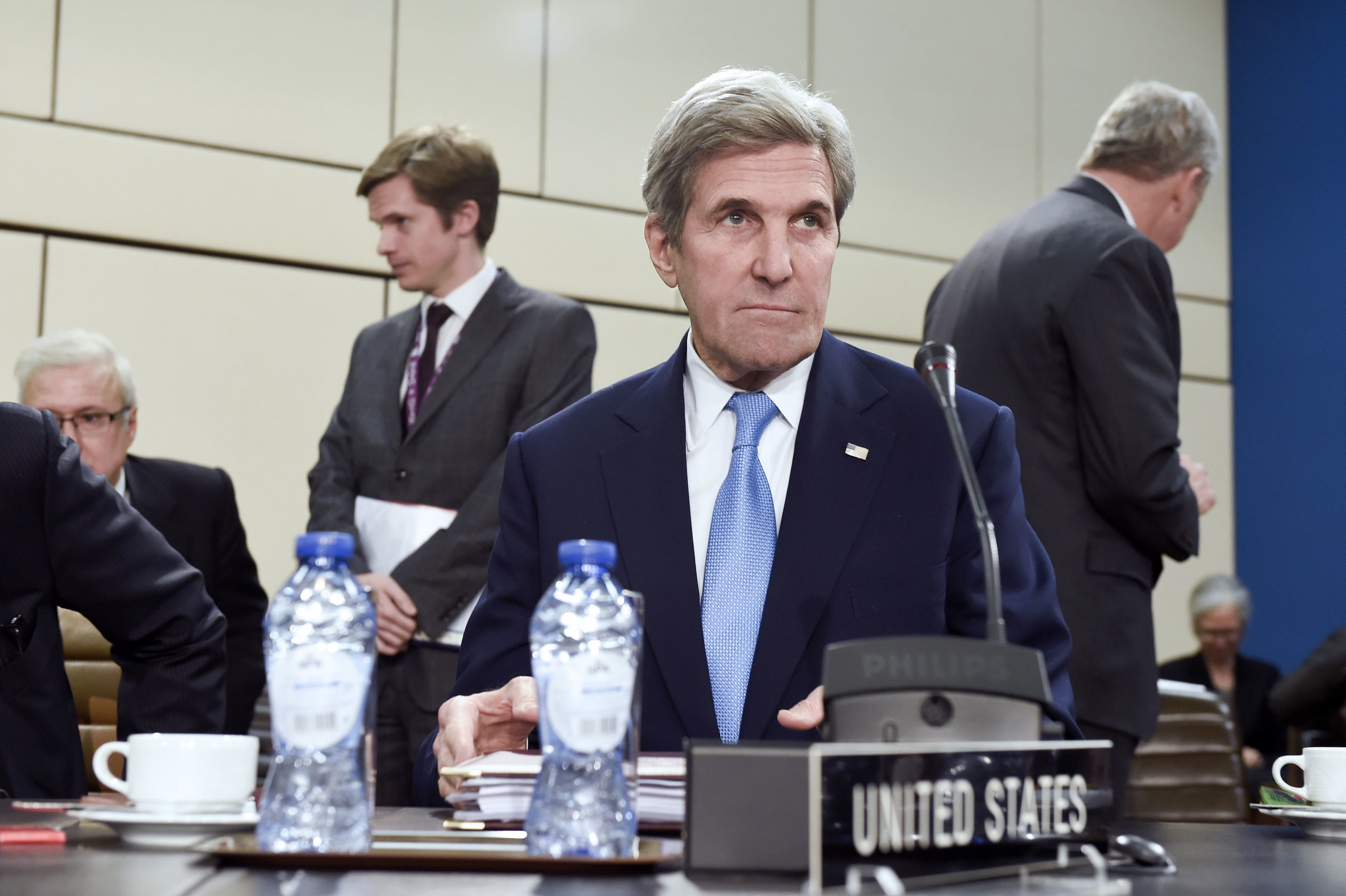 Secretary of State John Kerry attends a meeting of foreign ministers at the NATO headquarters in Brussels on Dec. 6. On Monday, Kerry issued an apology for the State Department's historical mistreatment of LGBT people. (AFP/Getty Images)