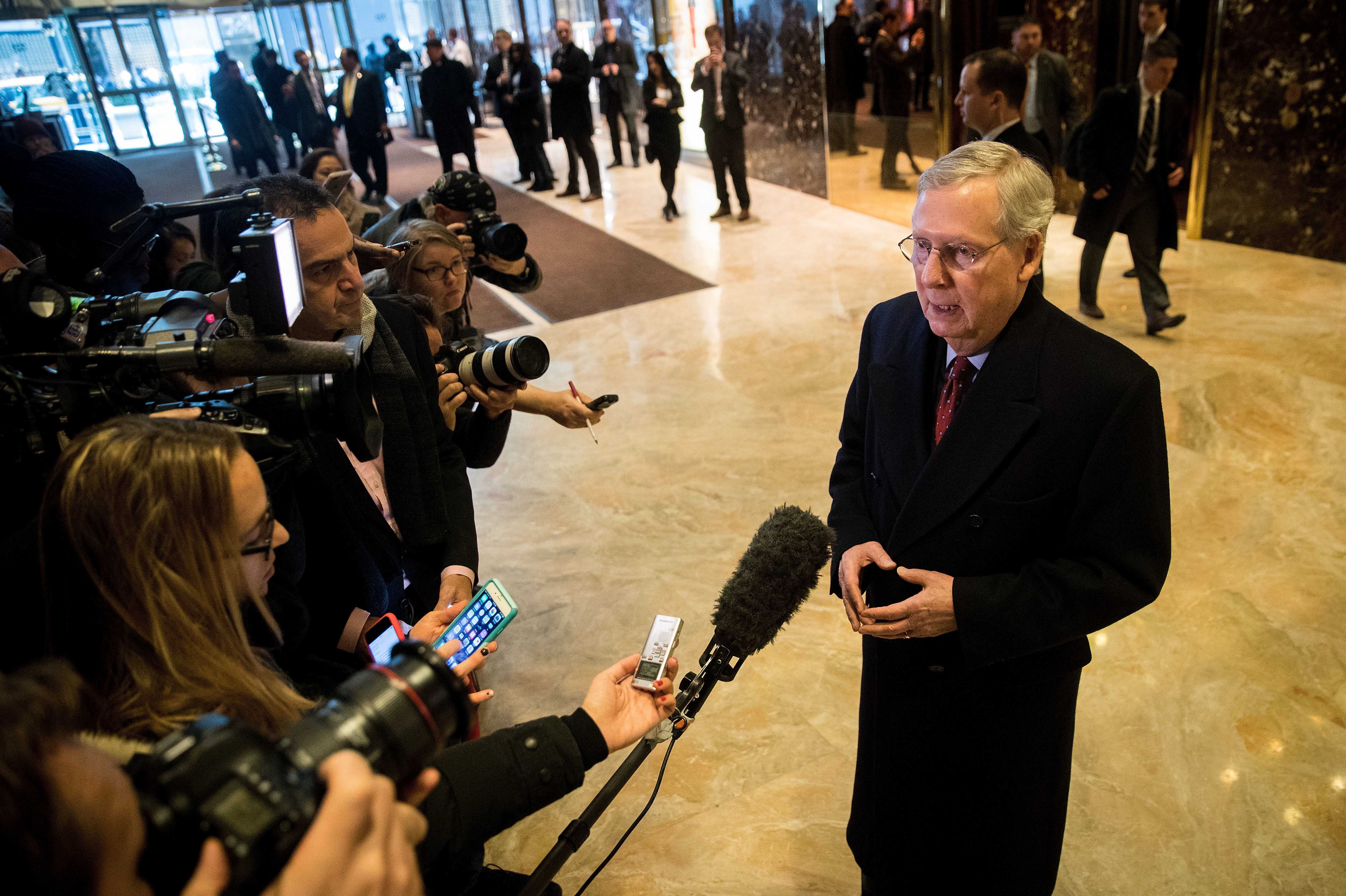 Speaking to reporters after meeting with President-elect Donald Trump, Senate Majority Leader Mitch McConnell says all Cabinet nominees will be properly vetted, despite concerns voiced by Democrats and the Office of Government Ethics. (Getty Images)
