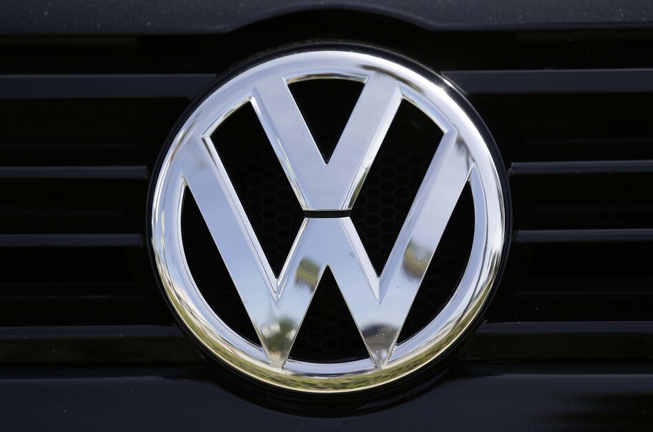 Volkswagen has agreed to plead guilty to three criminal felony counts as part of the settlement announced Wednesday by the Justice Department. (Damian Dovarganes/AP)