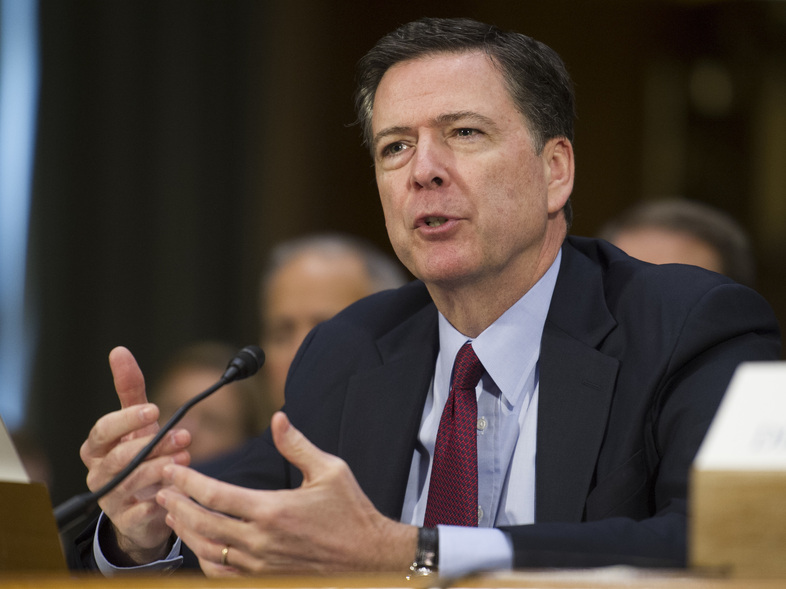 FBI Director James Comey, shown here testifying on Capitol Hill on Tuesday, has told friends and employees he had few good choices in the investigation into Clinton's handling of classified information on her private email server. (Cliff Owen/AP)