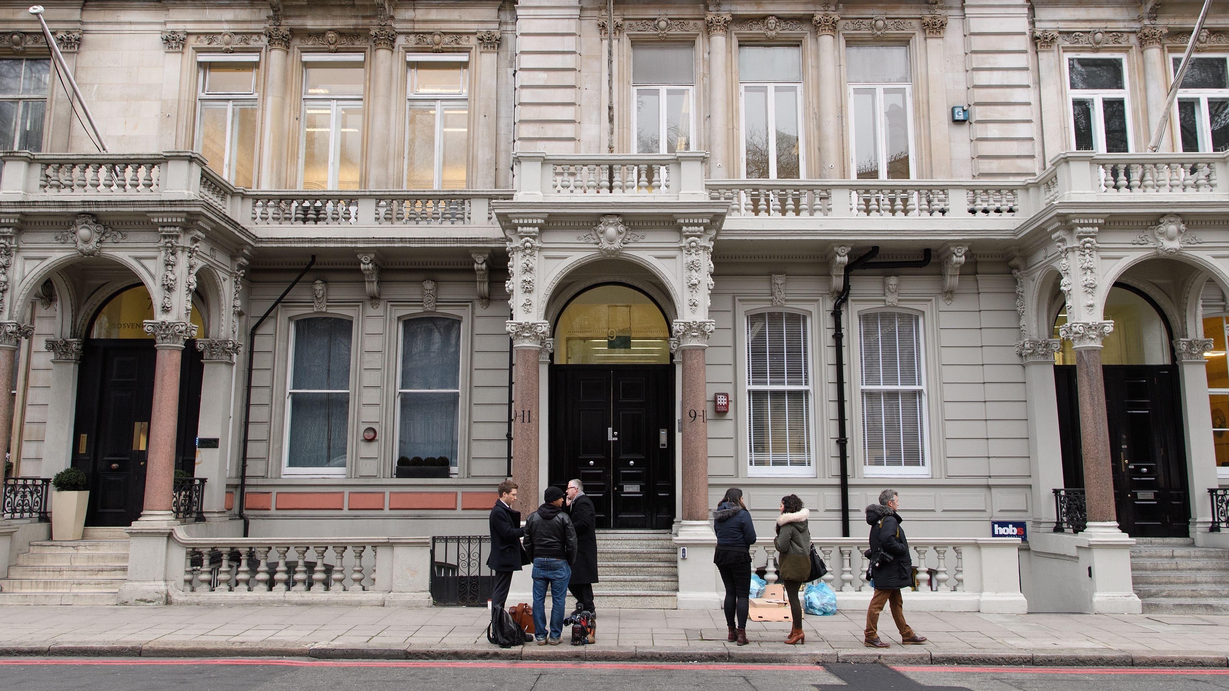 Journalists gather outside the London headquarters of Orbis Business Intelligence, the company co-owned by former British intelligence officer Christopher Steele, on Thursday. (Getty Images)