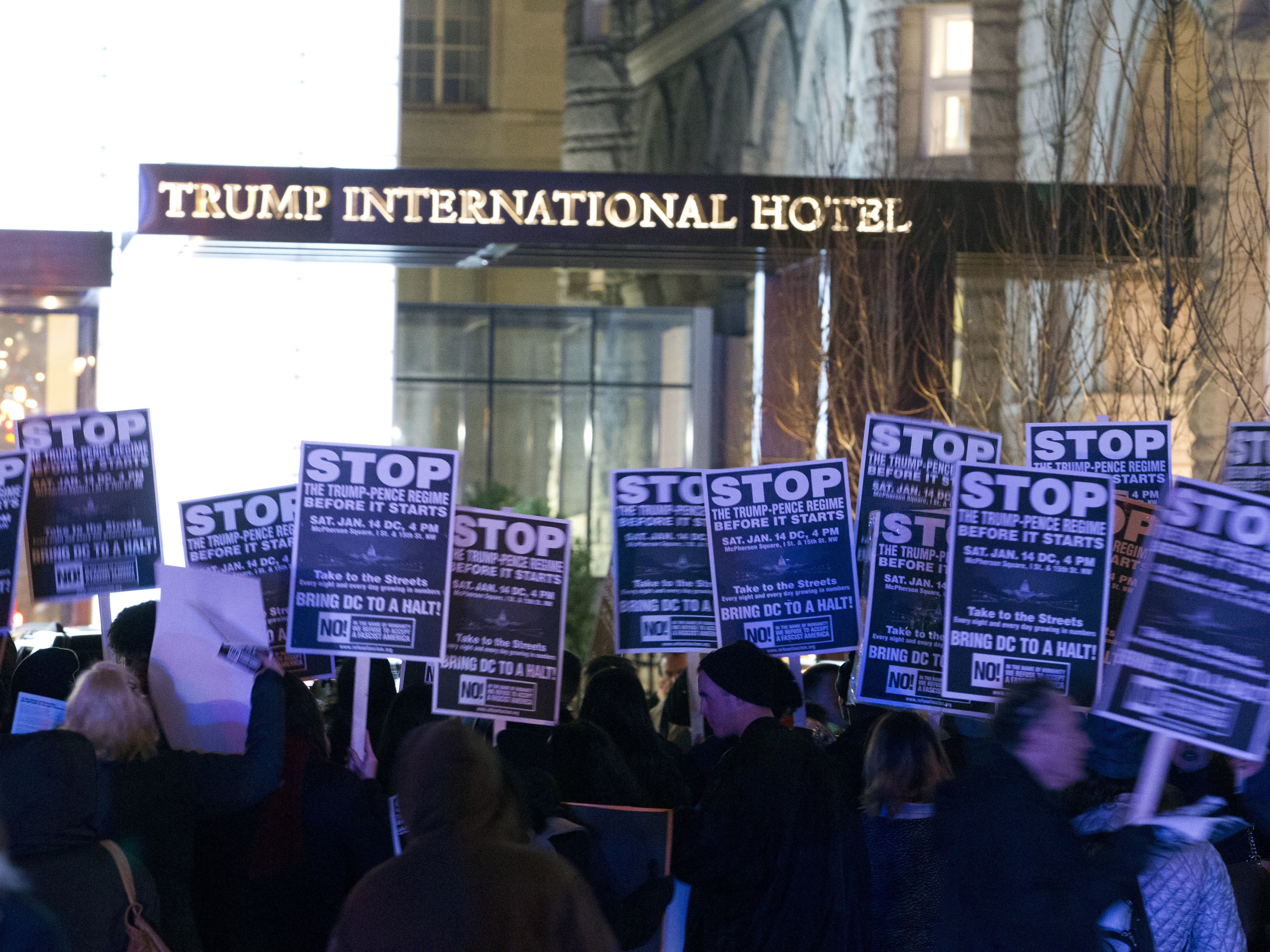 Demonstrators protest outside the Trump International Hotel in Washington, D.C., on Jan. 15. (Jose Luis Magana/AP)