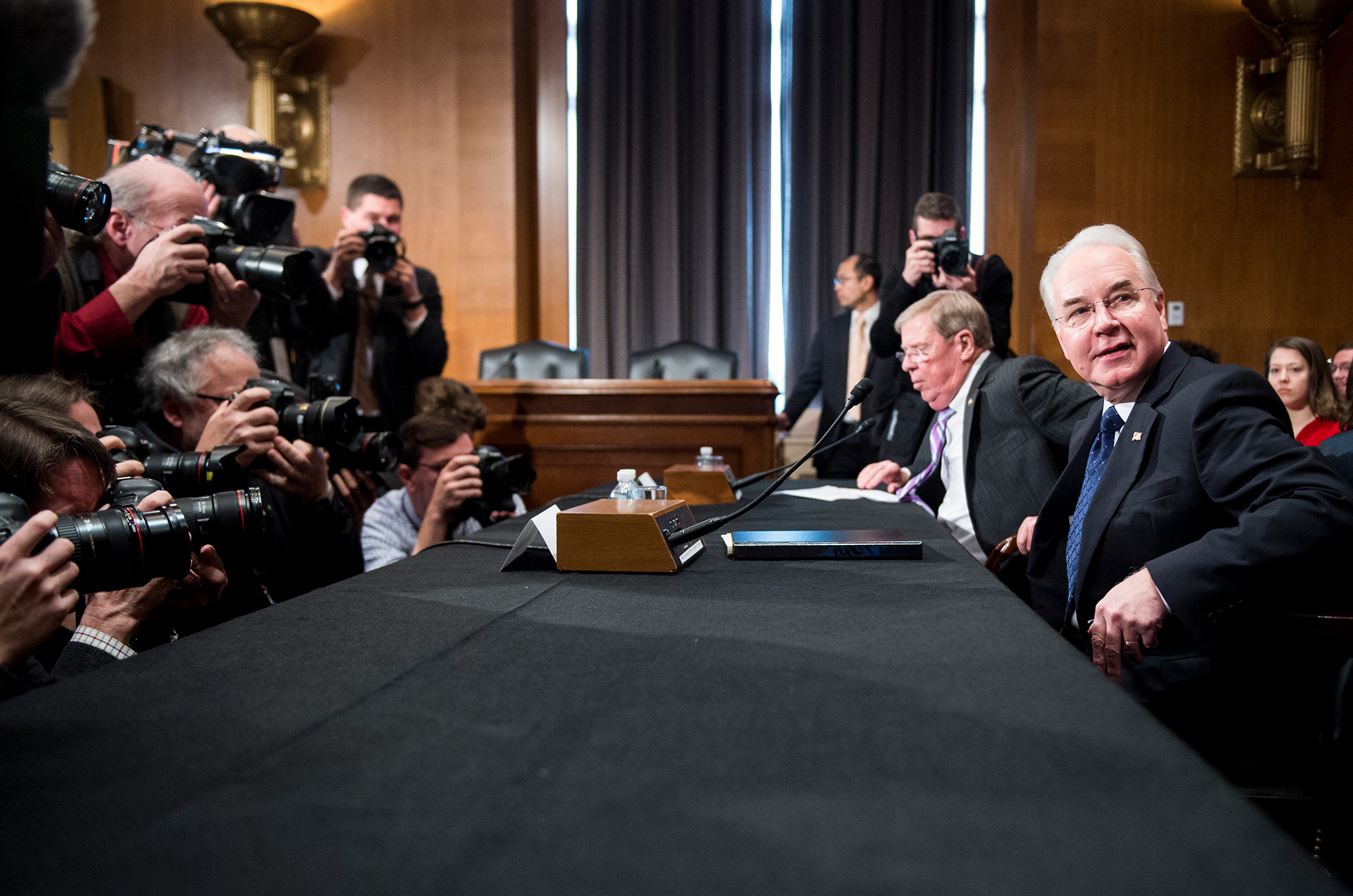 Secretary of Health and Human Services nominee Rep. Tom Price, R-Ga., (right) and Sen. Johnny Isakson, R-Ga., get settled before the start of Price's confirmation hearing Wednesday before the Senate Health, Education, Labor and Pensions Committee. (CQ-Roll Call,Inc.)
