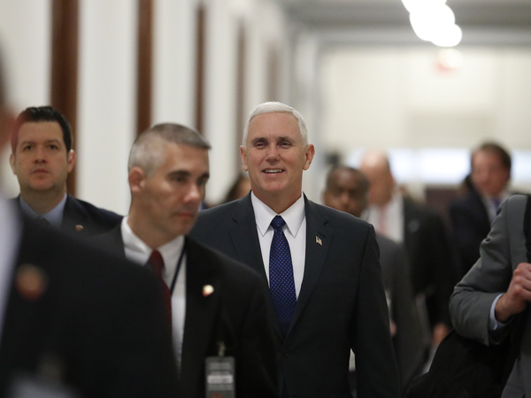 Vice President-elect Mike Pence walks through the halls of the Russell Senate Office Building on Capitol Hill on Tuesday.