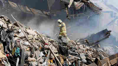 High-Rise Collapses In Tehran, Killing Firefighters Working Inside