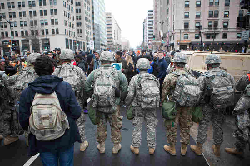 The National Guard makes a line in front of protesters at the intersection of K Street and 14th Street Northwest.