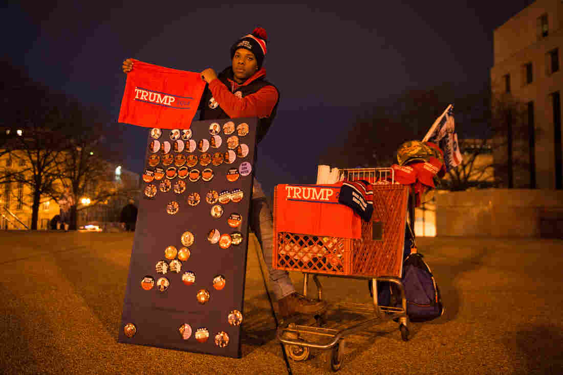 Timothy Moore stands outside one of the entry points to the National Mall selling Trump merchandise to earn money for college. His most-sold item is the Trump towels.