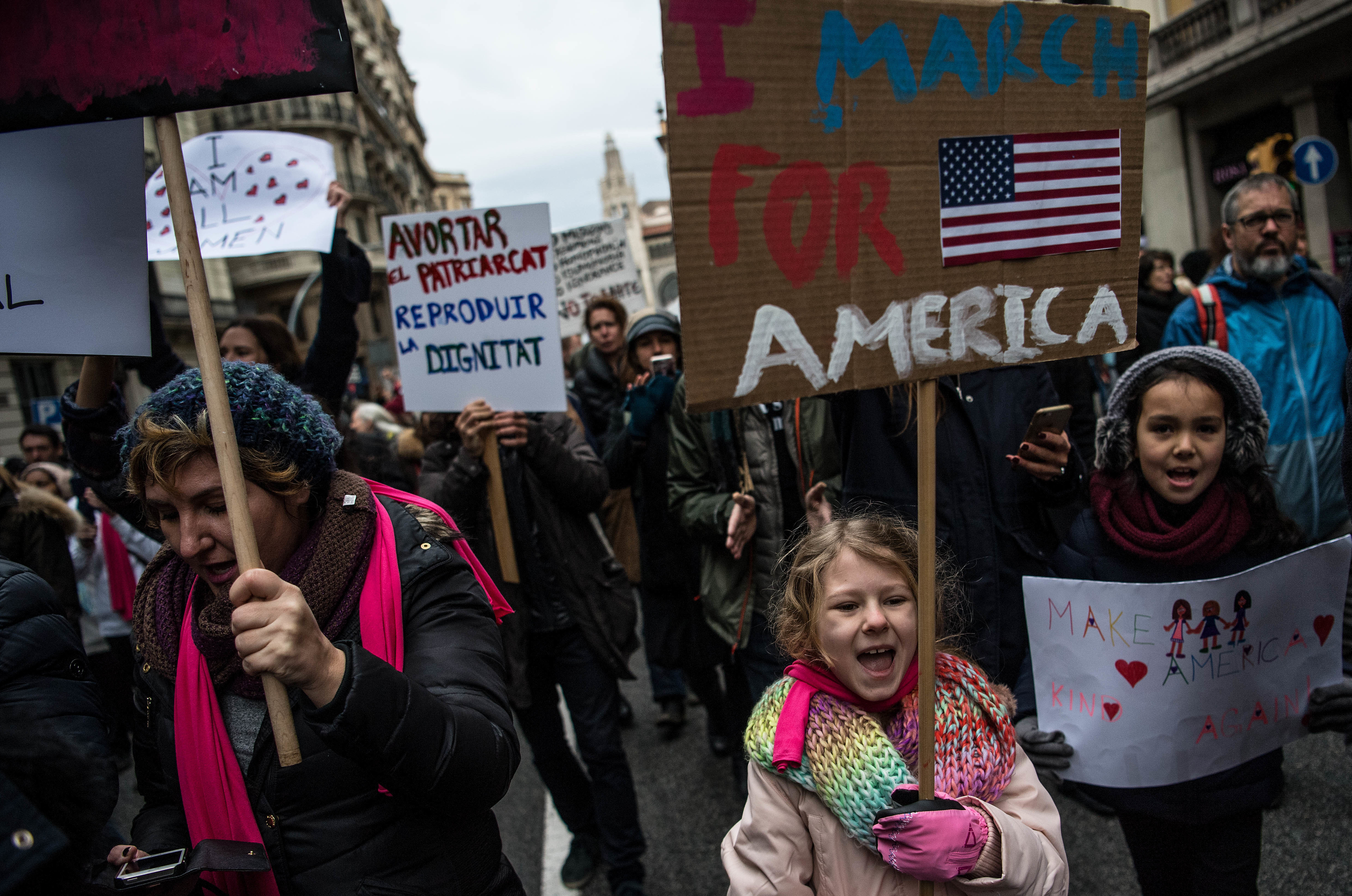 Demonstrators bear their signs at the women's march in Barcelona, Spain. The Spaniards drew inspiration from the Women's March on Washington, but due to the time difference, they actually hit the streets before the Americans. (Getty Images)