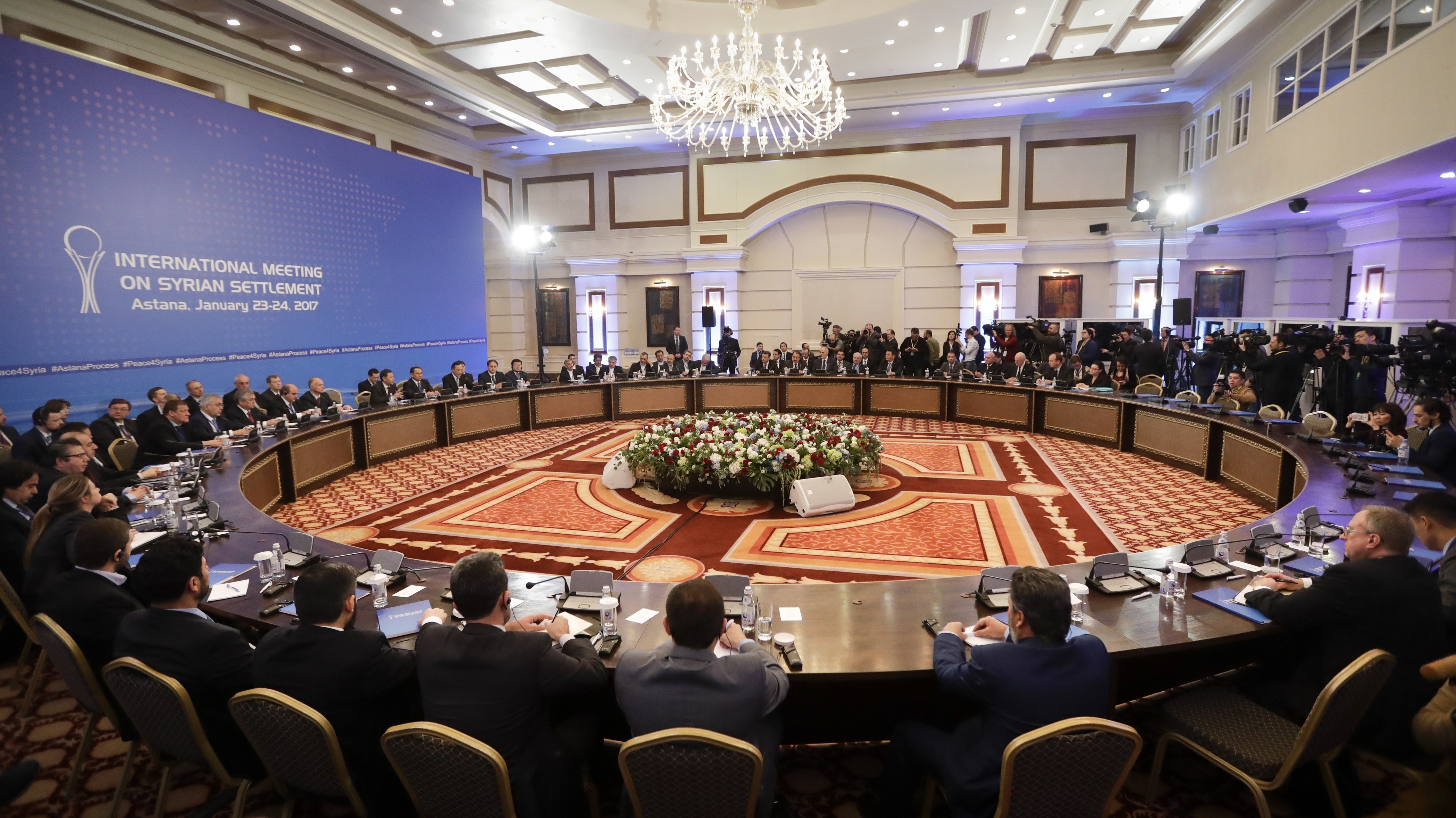 Delegates from Russia, Iran and Turkey lead talks on Syrian peace in Astana, Kazakhstan, where U.S. involvement is minimal compared to other recent attempts to end Syria