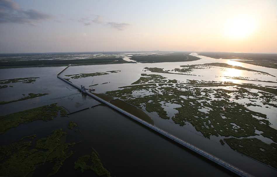 Wetlands and marshlands that once protected New Orleans and the surrounding areas from storm surge have been depleted over the years. Here, the $1.1 billion Lake Borgne Surge Barrier outside New Orleans in 2015. (Mario Tama/Getty Images)