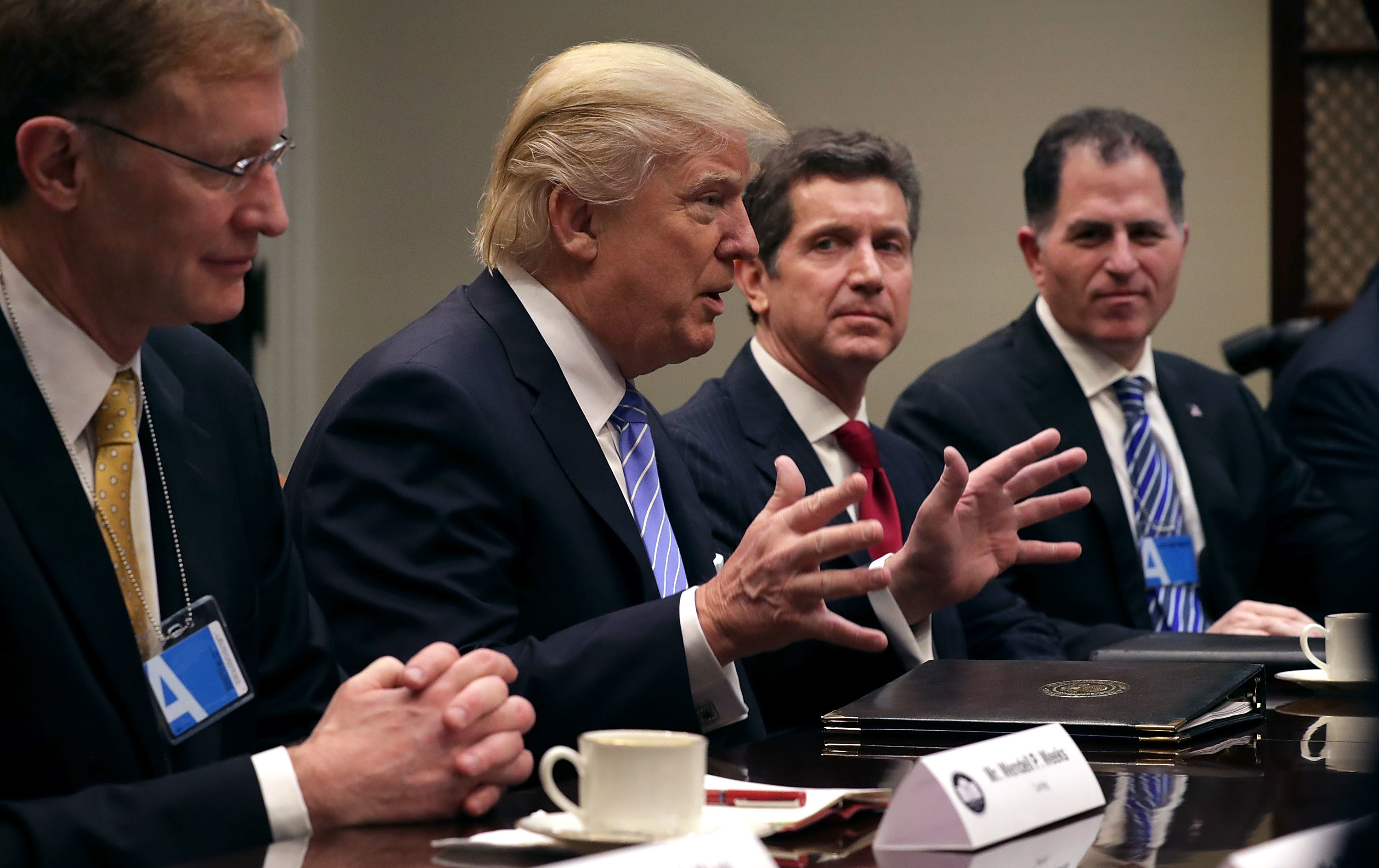 President Trump delivers opening remarks during a meeting with (from left) Wendell Weeks of Corning, Alex Gorsky of Johnson & Johnson, Michael Dell of Dell Technologies and other business leaders in the Roosevelt Room at the White House on Monday. (Getty Images)