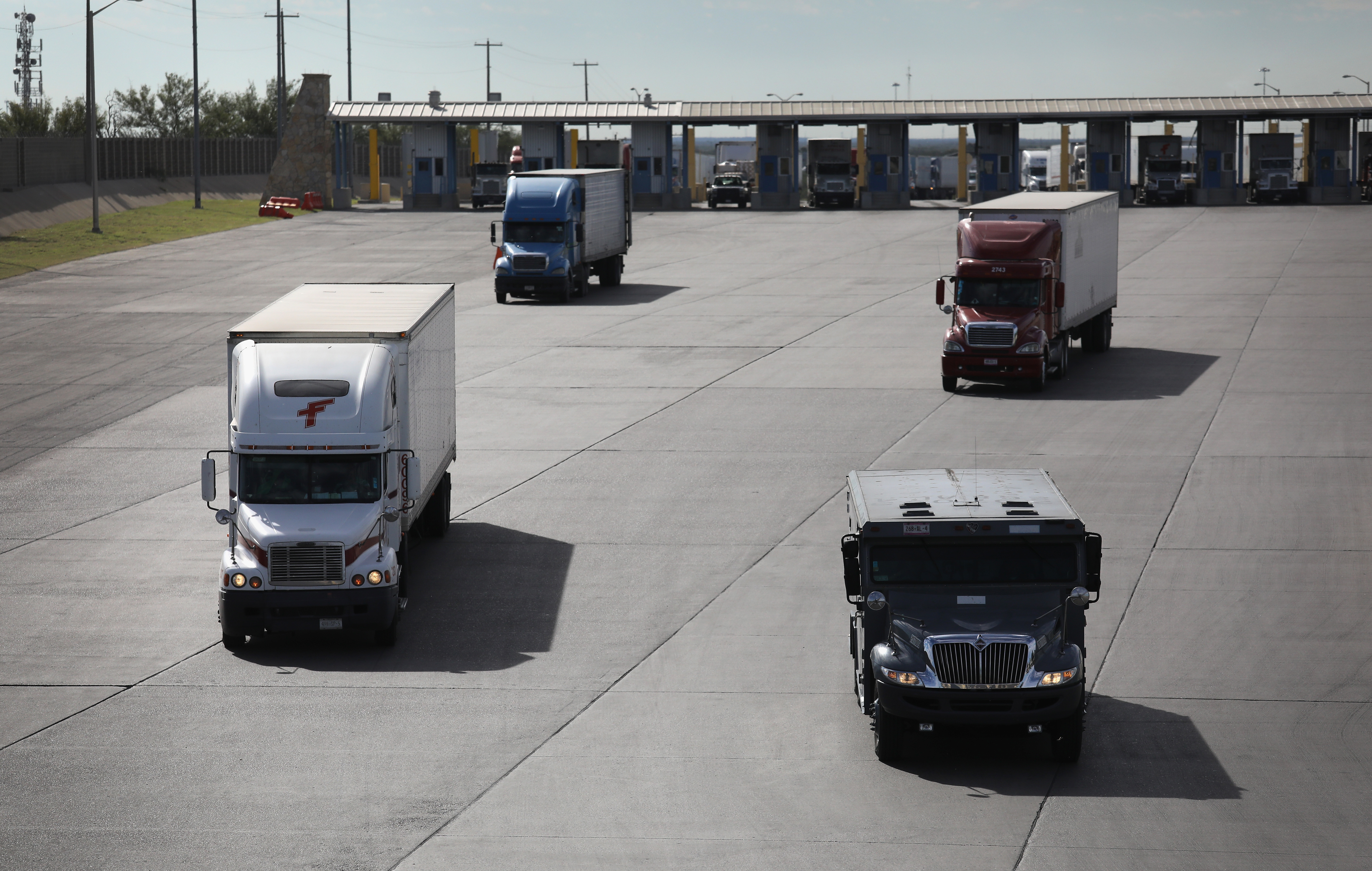 Trucks, including an armored car, pass through U.S. customs in 2016 in Laredo, Texas. (Getty Images)