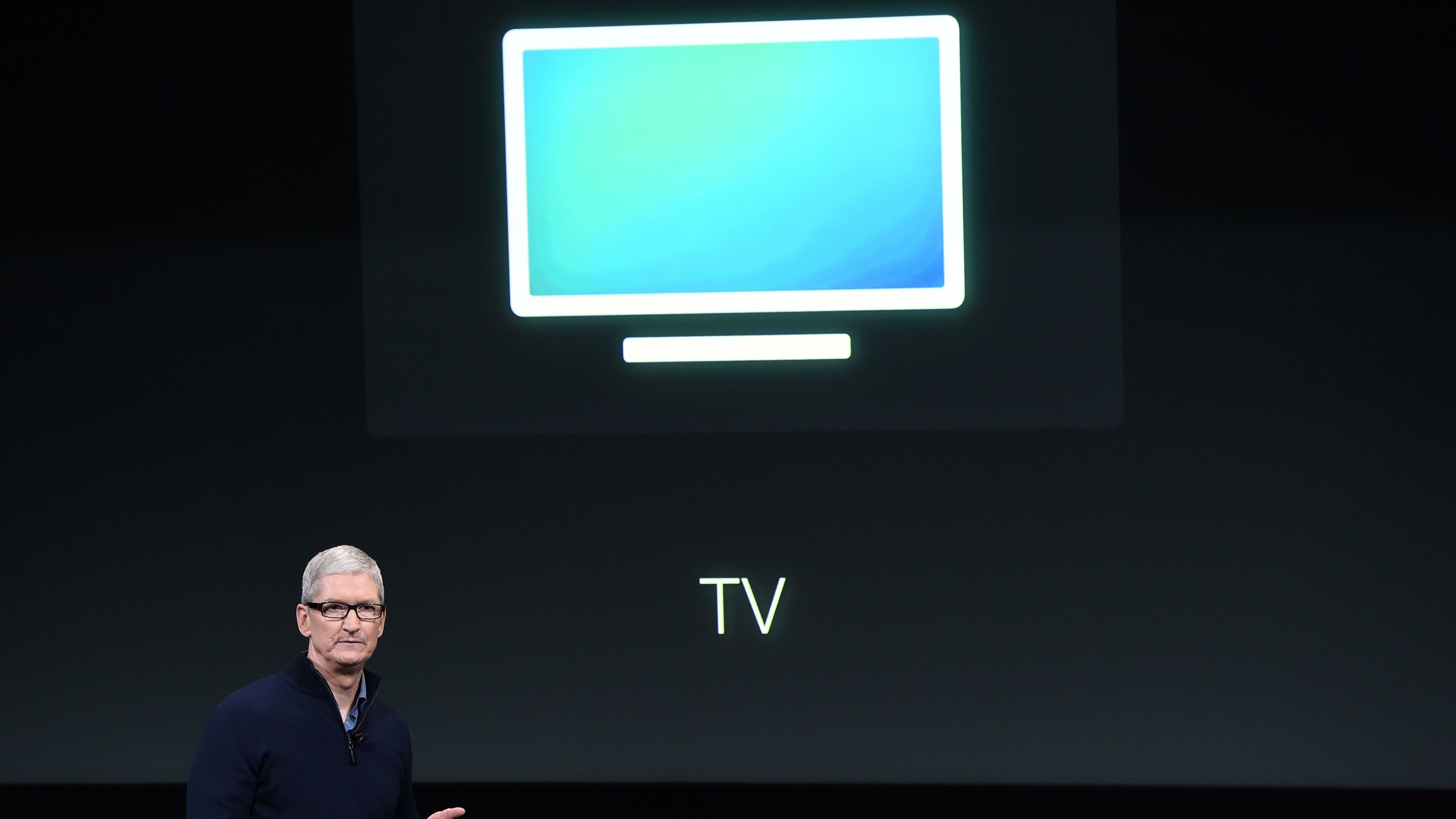 Apple CEO Tim Cook introduces the new Apple TV app during a product launch event in Cupertino, Calif., in October. The company now plans to make original movies and TV programming, according to sources.