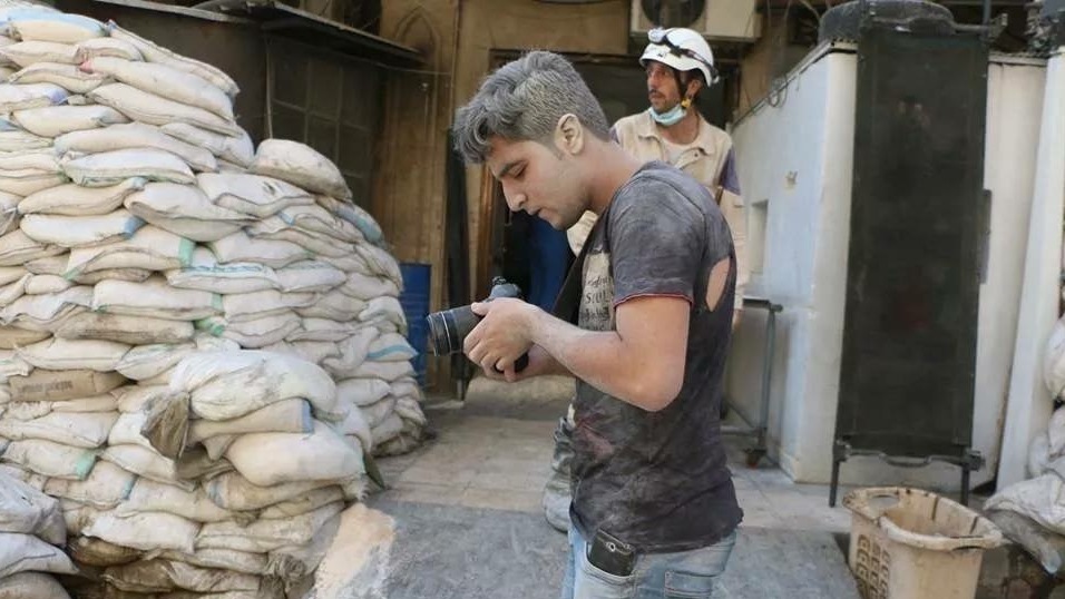 Khaleed Khateeb, 21, was the videographer for the Netflix documentary The White Helmets. "This photo was after double tap of aircraft on July 27, 2014," he says, referring to an airstrike followed by another attack. "I don