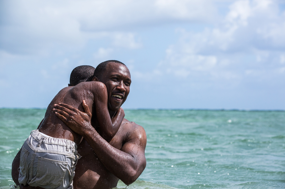 Mahershala Ali holds Alex Hibbert in the film, <em>Moonlight</em>. Ali was nominated for an Oscar for supporting actor. (David Bornfriend/A24)