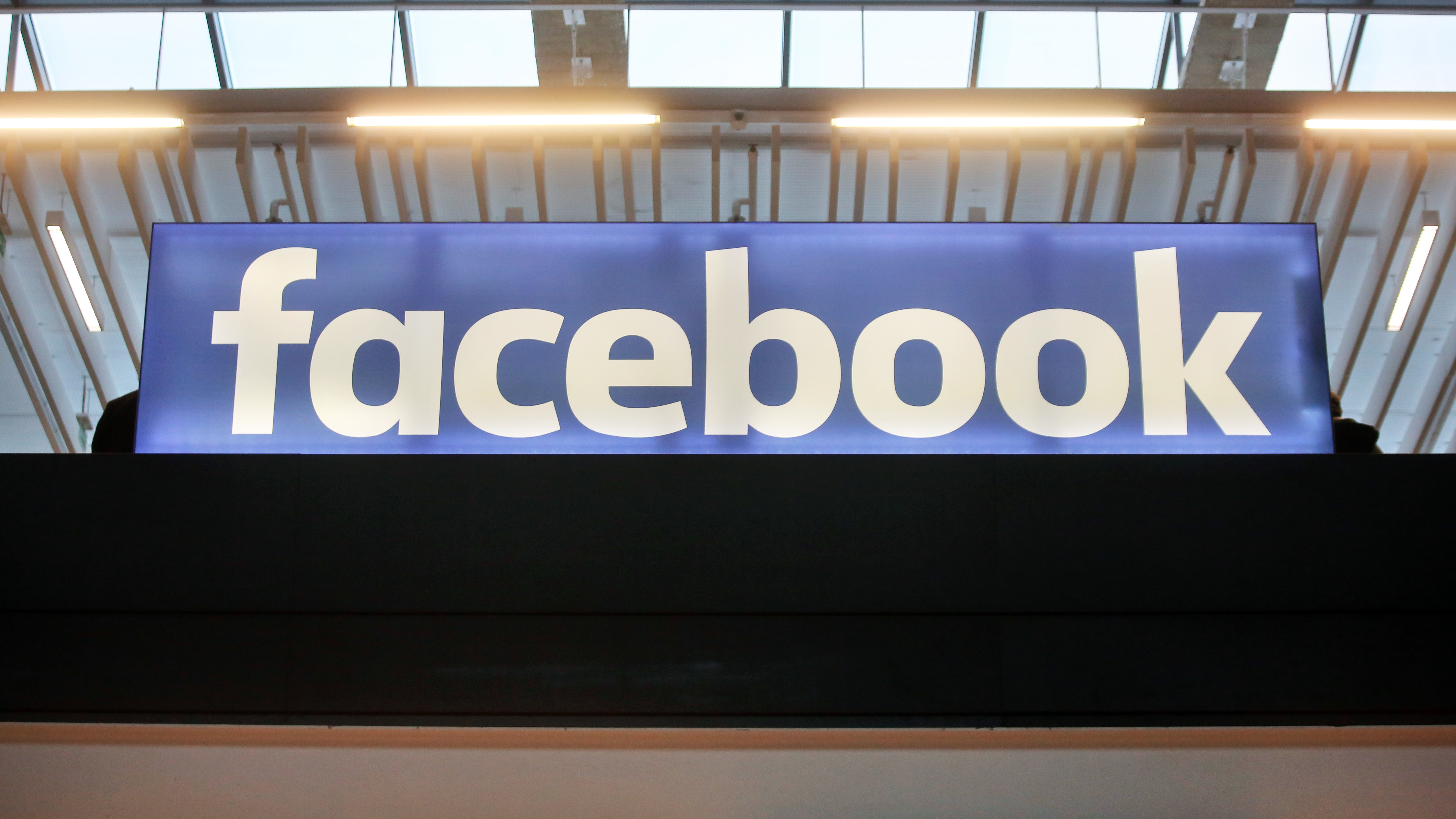 The Facebook logo is displayed at a startup gathering in Paris on Jan. 17.