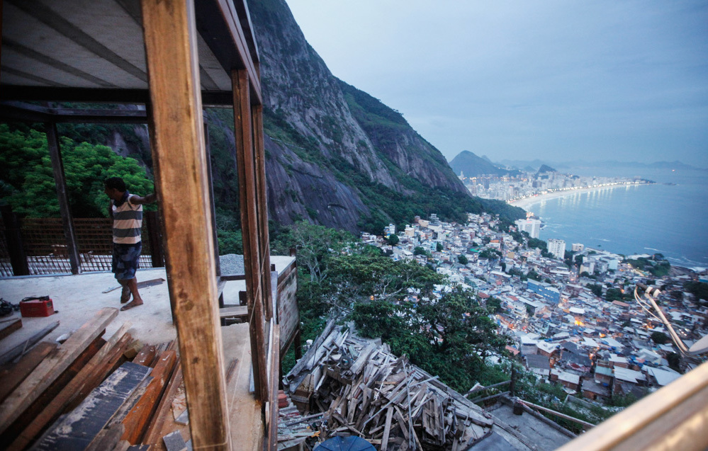 A worker stands in a construction project in a <em>favela</em>, or shantytown, in Rio de Janeiro, Brazil. The government has helped drive down income inequality by investing in basic services like health care, education and pensions. (Getty Images)