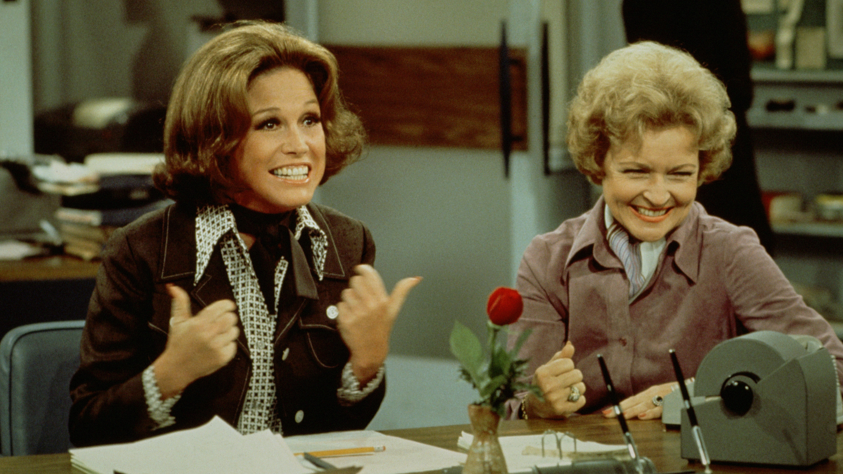 Mary Tyler Moore (left, as Mary Richards) gives a 