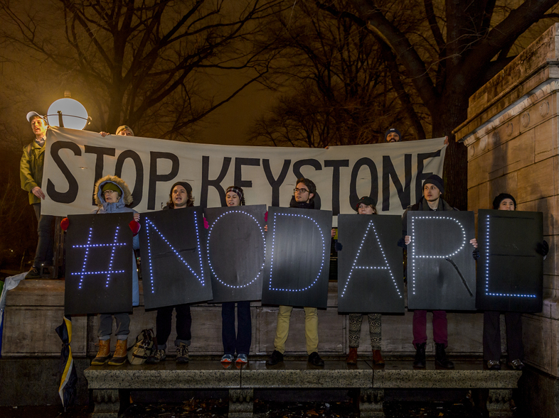 Hundreds of New Yorkers gathered at Columbus Circle in New York for a protest march to Trump Tower after the president signed an order to advance the Keystone XL and Dakota Access pipelines. (Pacific Press/LightRocket via Getty Images)