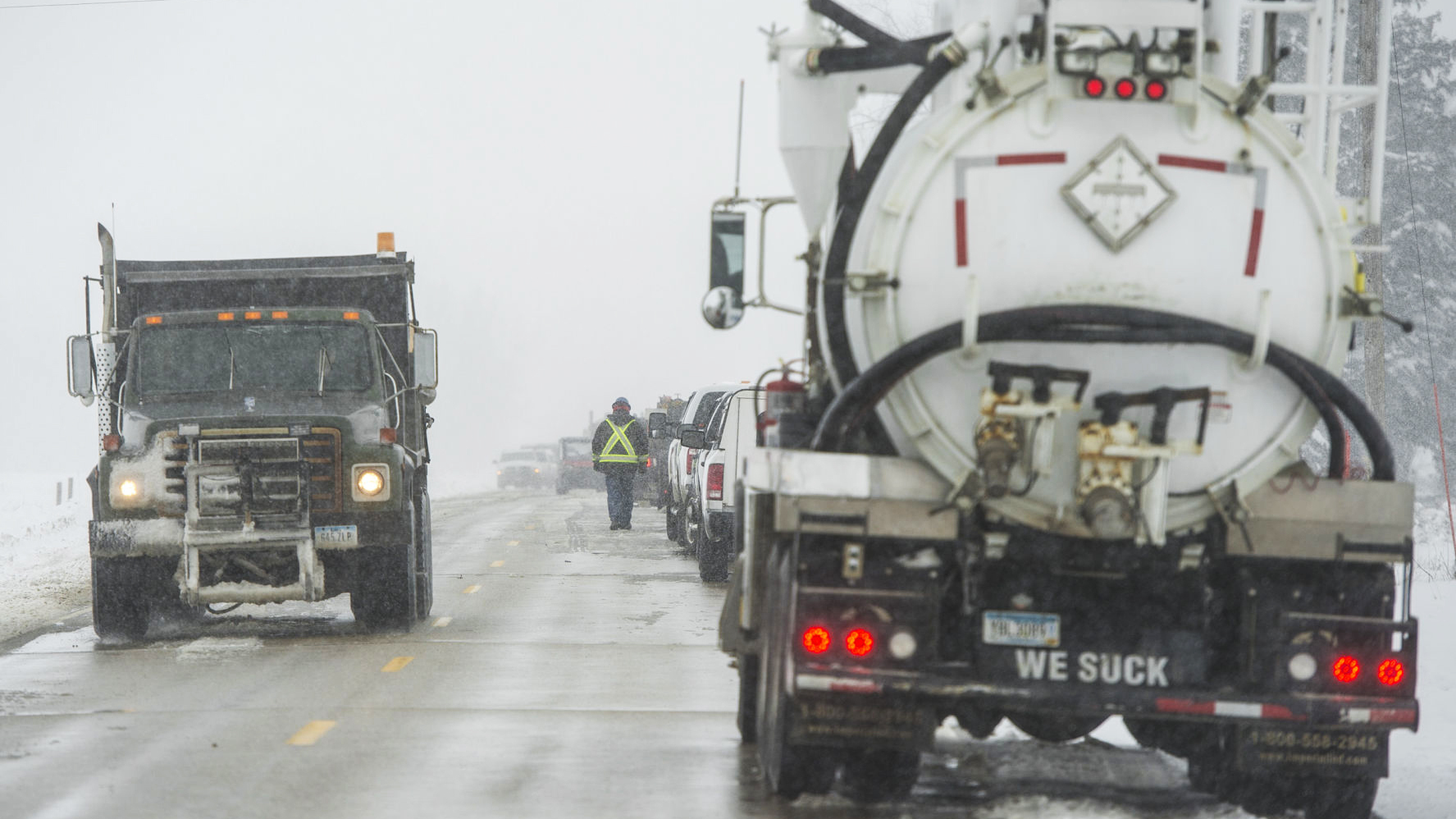 Crews clean up the diesel fuel spill after a pipeline broke in Worth County, Iowa on Wednesday.