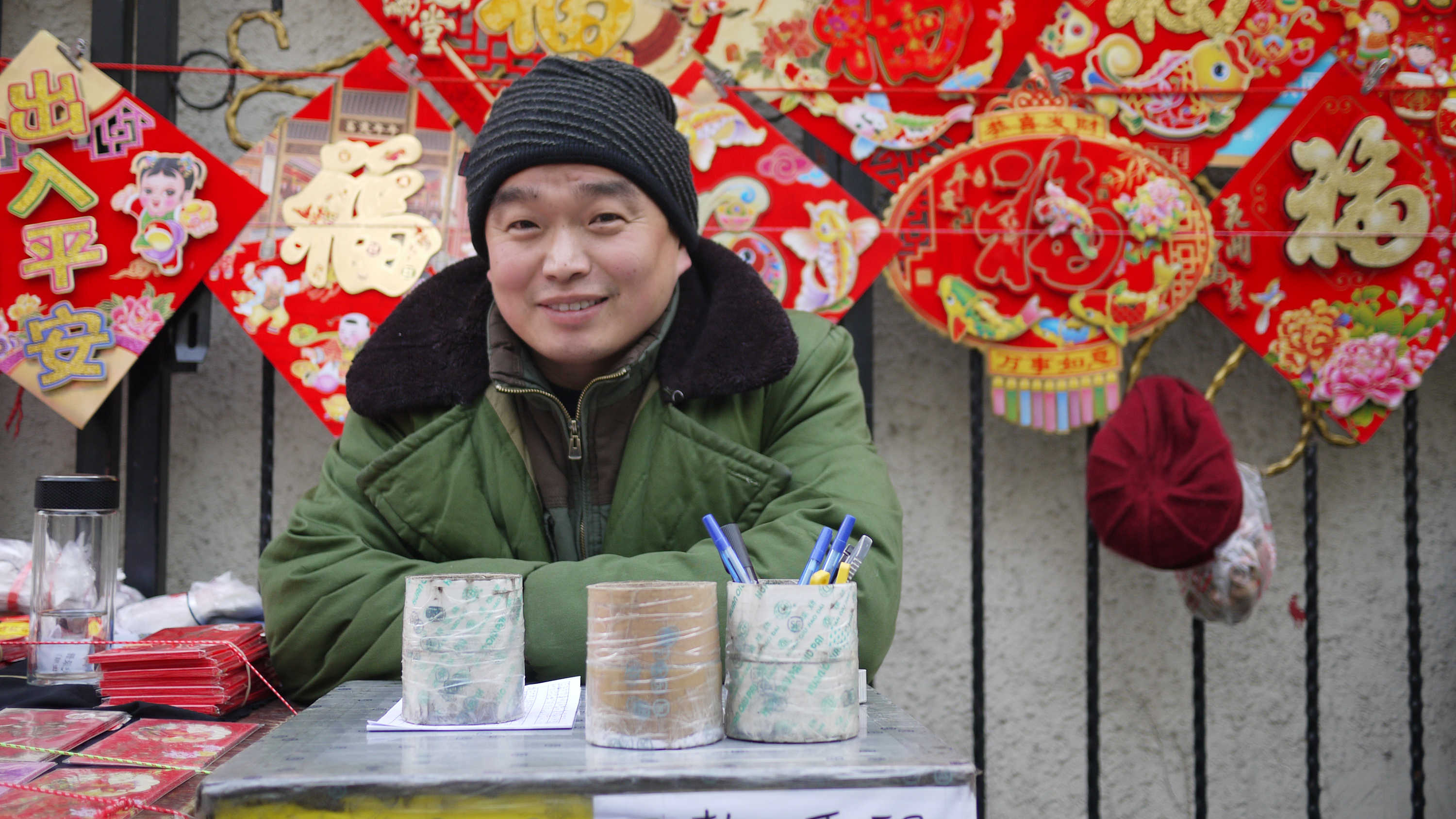 The last remaining street vendor in Rising Peace Lane before new year celebrations begin sells new year