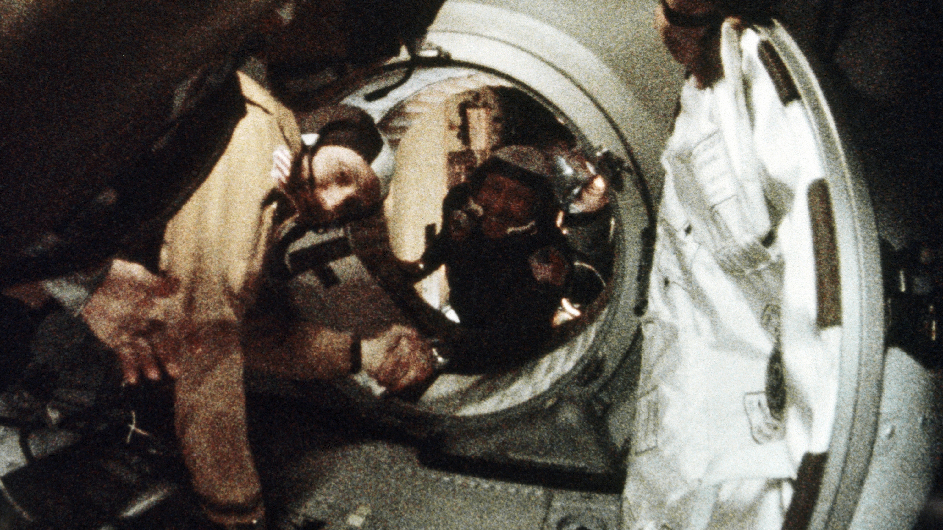 Astronaut Tom Stafford (left) and cosmonaut Alexey Leonov shake hands after the first docking of U.S. and Soviet spacecraft in 1975.