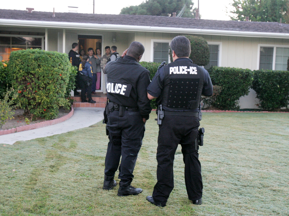 Immigration agents conduct an arrest in Southern California. President Trump's executive order on immigration broadened the category of immigrants whom the government considers a priority for deportation. (J. Emilio Flores/Corbis via Getty Images)